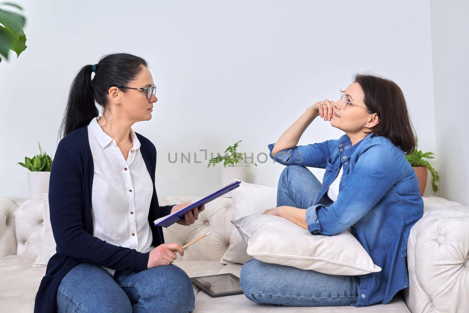 Mature woman at meeting with psychologist, therapist, counselor. Professional help, mental health of middle-aged people, social difficulties