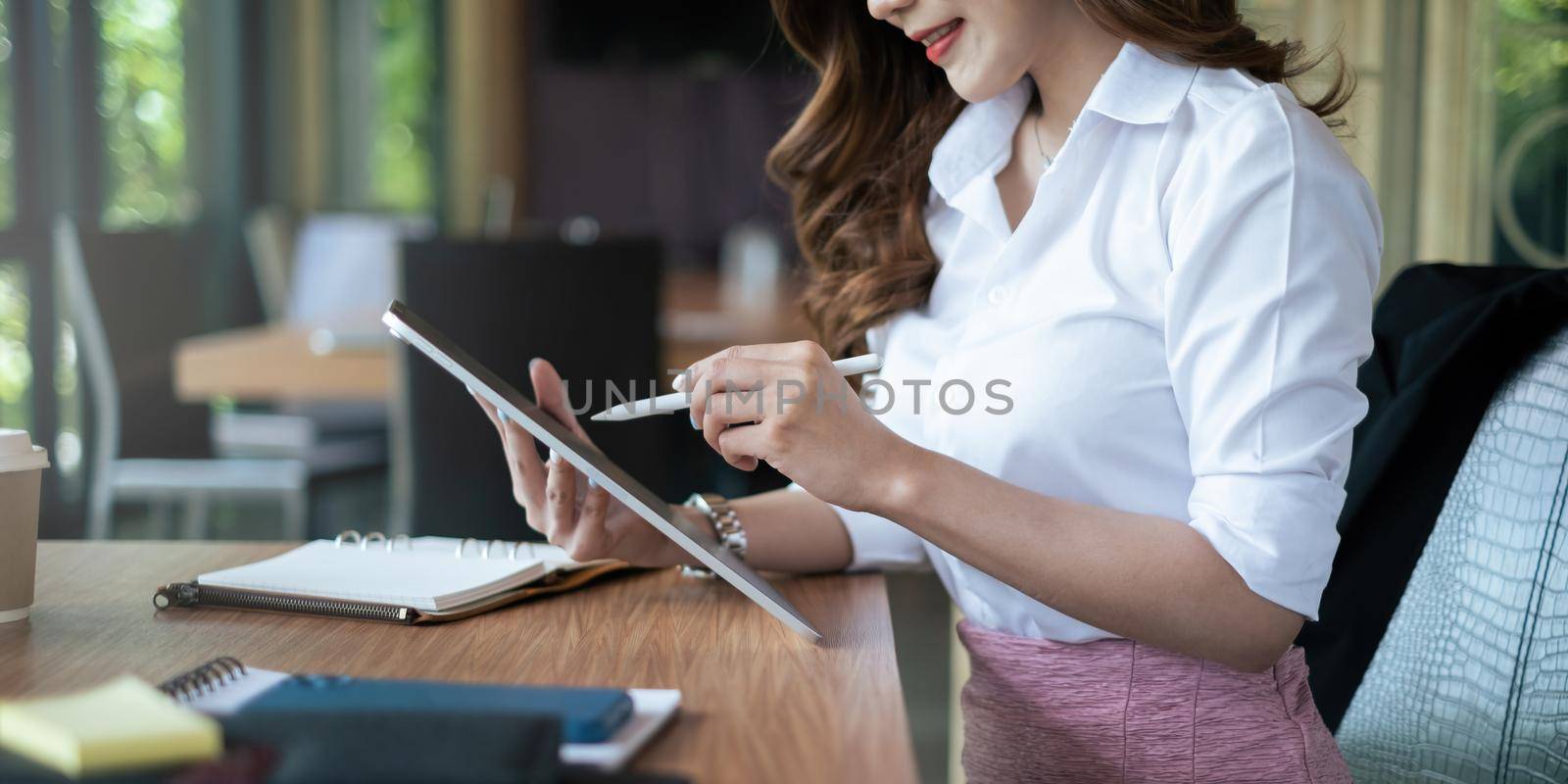 Young undergraduate student studying financial online class by digital tablet. Online class concept.