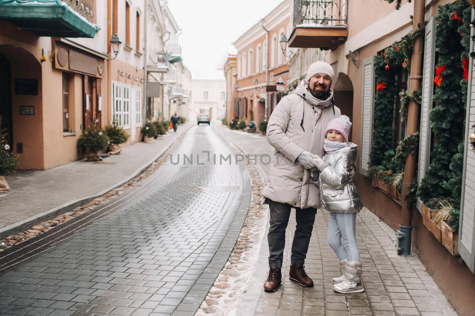 A family walks around the New Year's city of Vilnius.Lithuania.