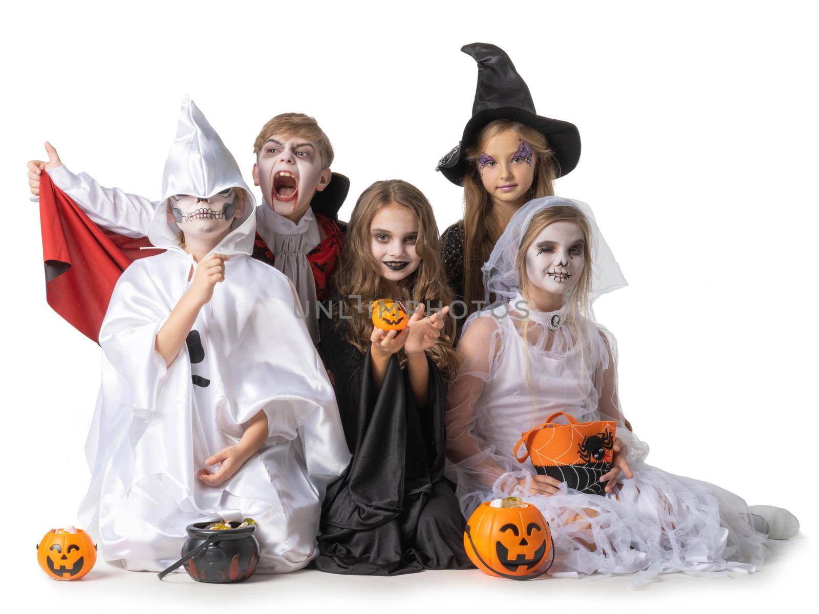 Group of children in fancy Halloween costume dress isolated on white background, going trick or treating