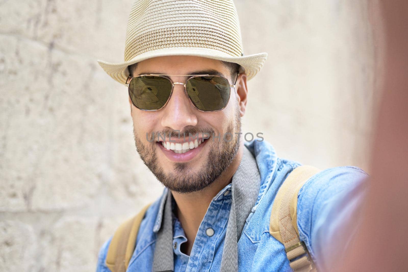 Happy tourist taking selfie in old city. High quality photo.