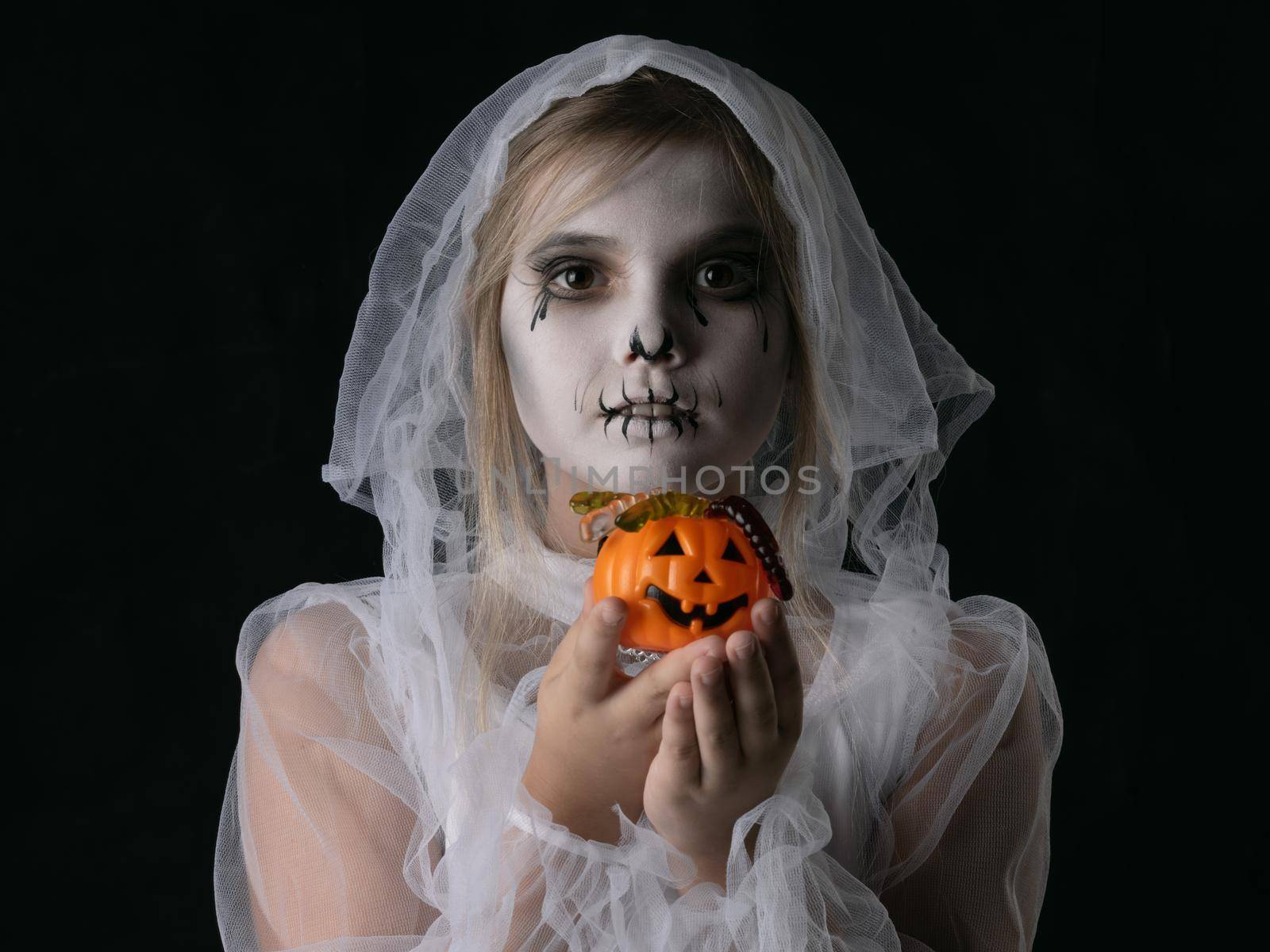 Girl Halloween ghost with candy pumpkin by Yellowj