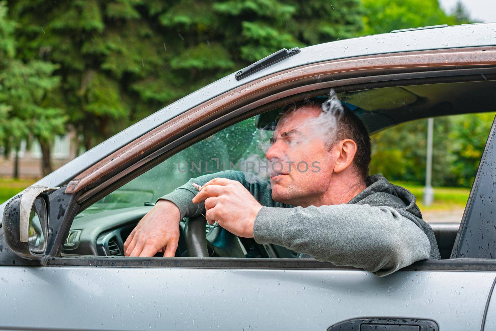 The driver enjoys smoking while driving his car by Skaron