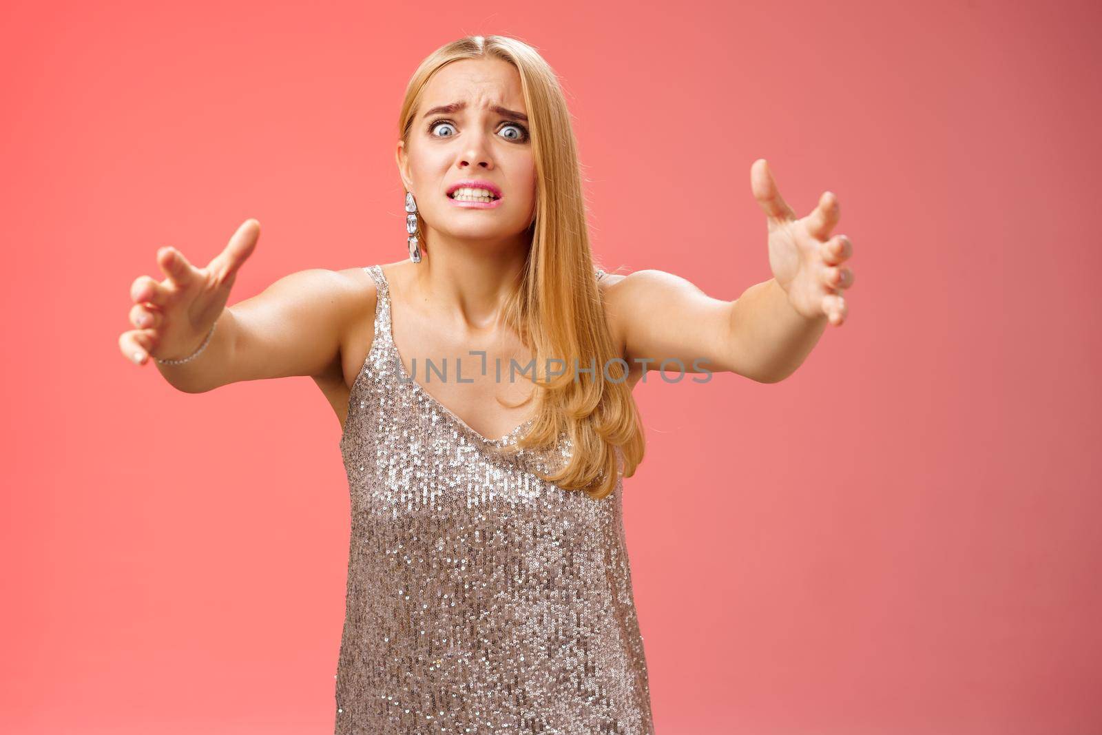 Obsessed ex-girlfriend widen eyes crazy clench teeth stretch hands forward wanna hold tight forever together standing crazy weird red background in silver dress clingy girl want hugs, cuddles.