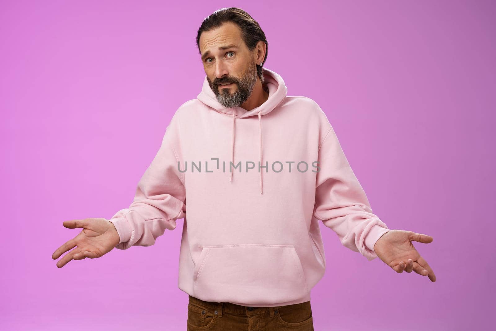 Nothing man could do. Mature bearded guy grey hair 40s spread hands dismay cannot help gesture frowning apologizing shrugging unaware standing perplexed not know anything, purple background by Benzoix