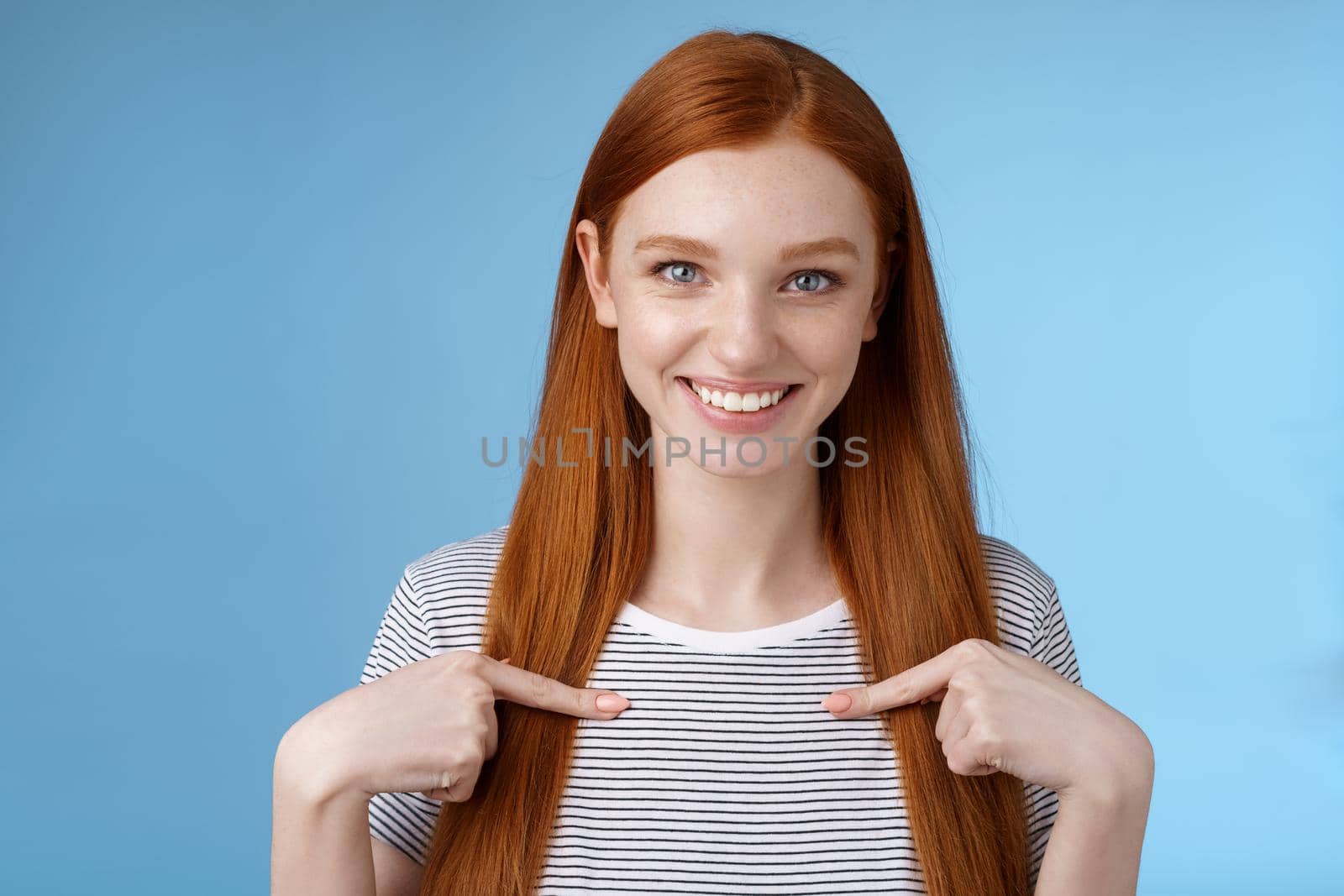 Me seriously. Glad surprised happy carefree redhead tender feminine girl pointing herself smiling laughing amused picked chosen participate performance standing thrilled joyful blue background by Benzoix