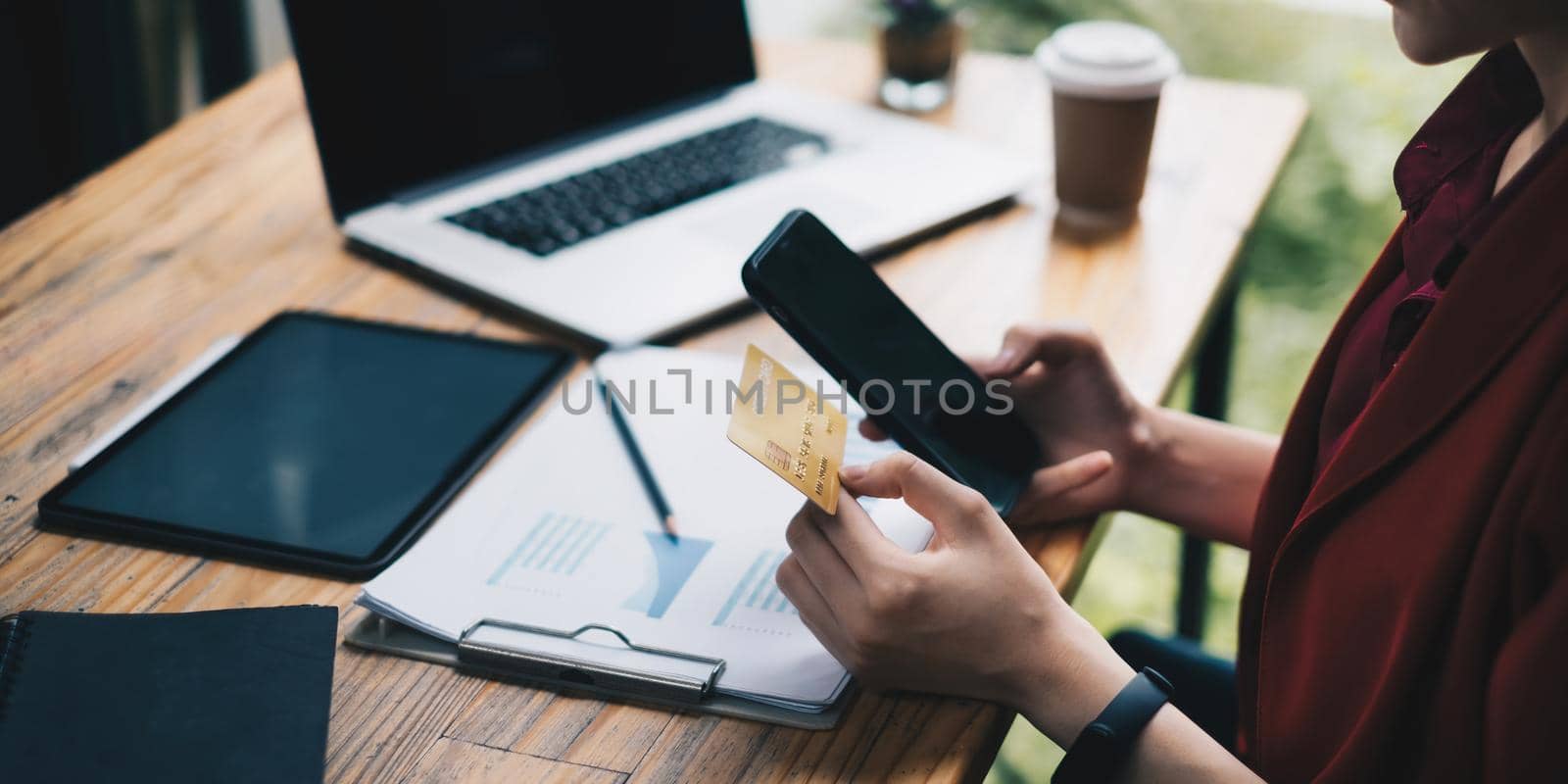 Woman checking her bill of credit card by application on smartphone. Online payment concept