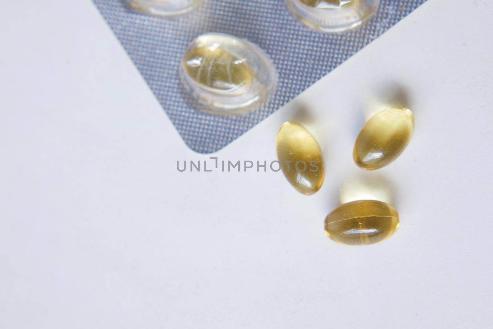 fish oil supplement on white background by towfiq007