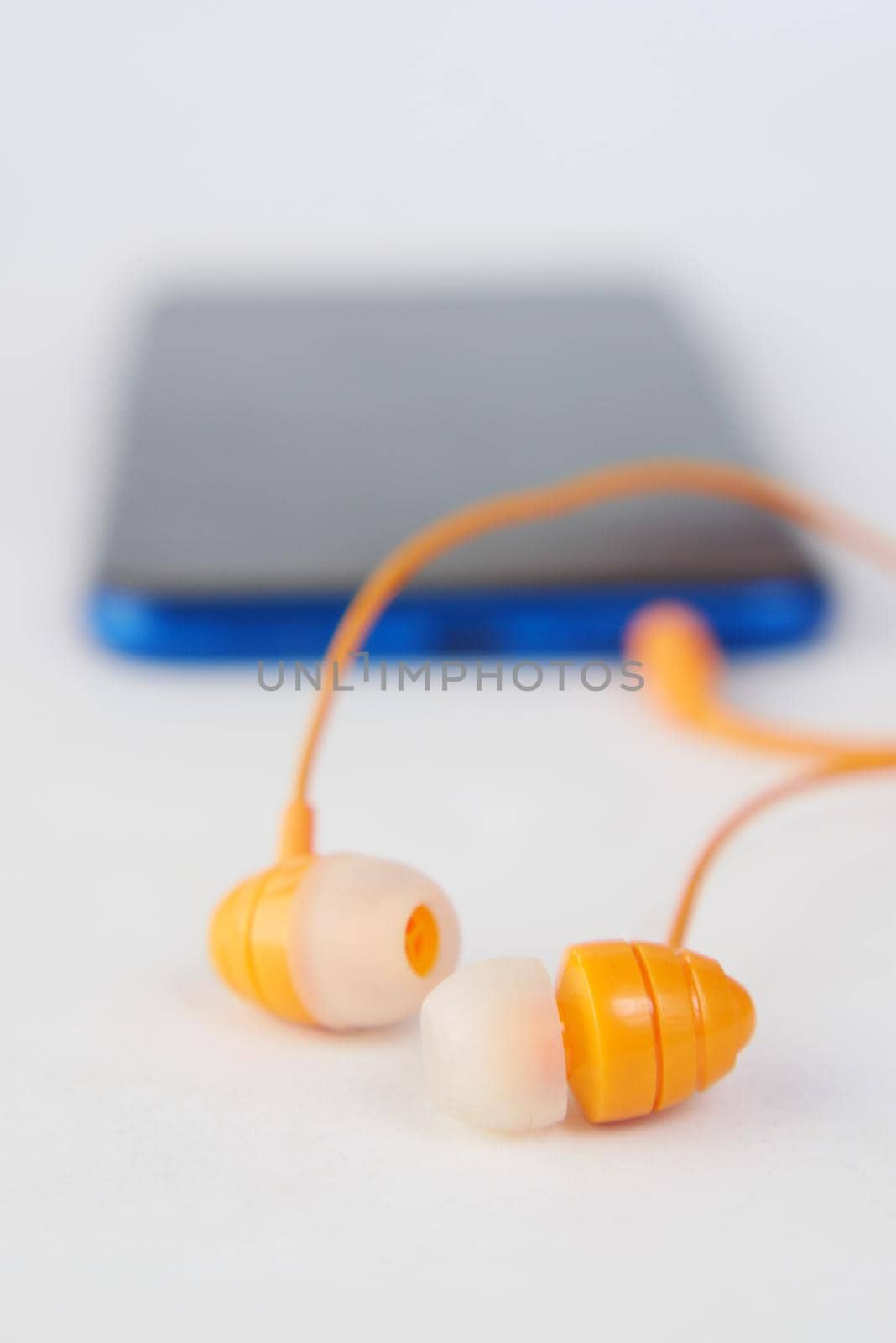 smart phone and earphone on white background .