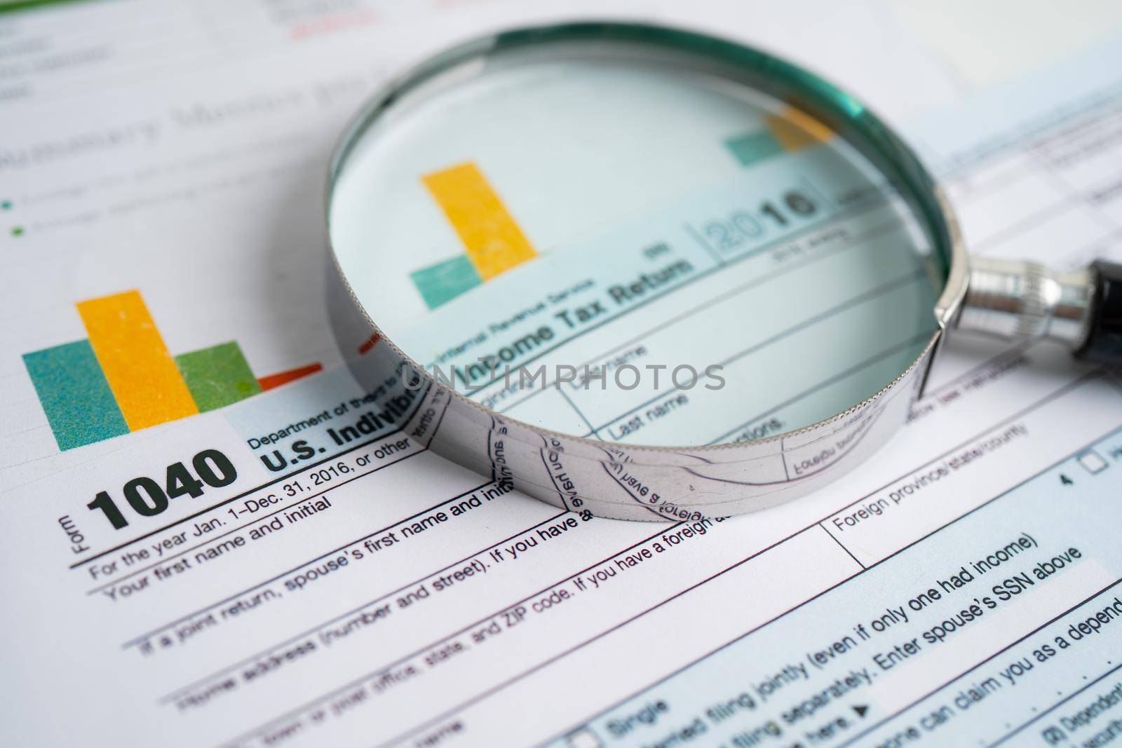 Tax Return form 1040 and dollar banknote, U.S. Individual Income.