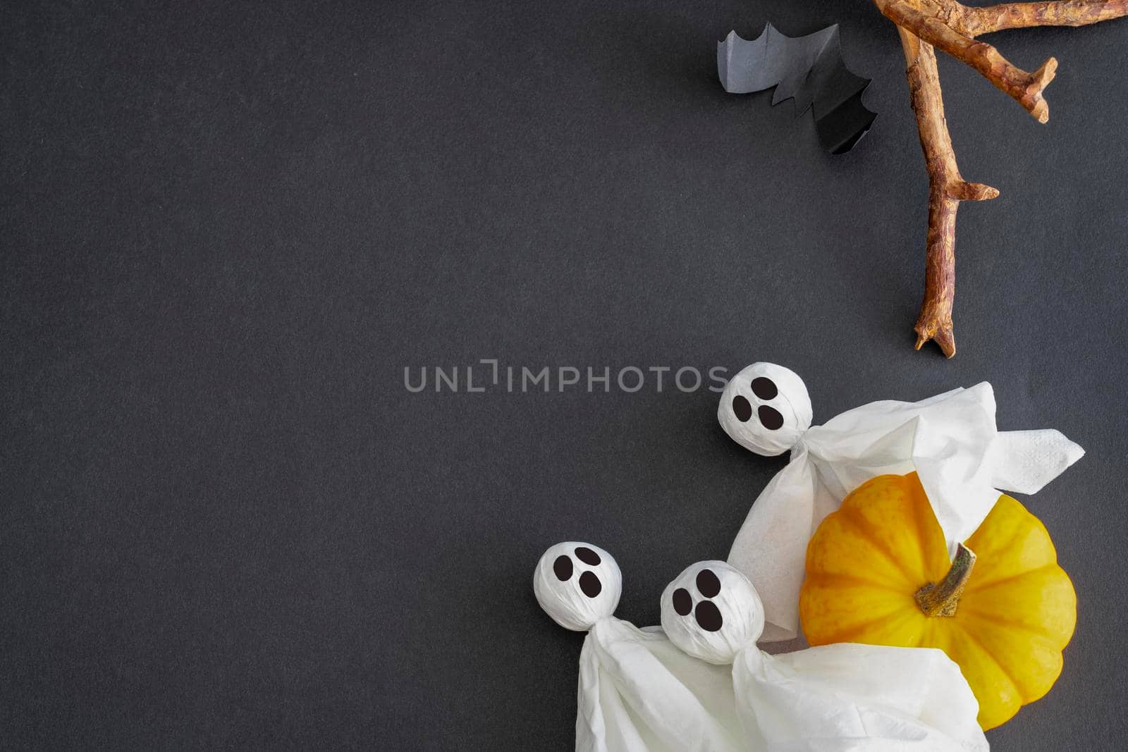Ghosts, bat, pumpkin on black background. Concept Halloween. Copy space. by Laguna781