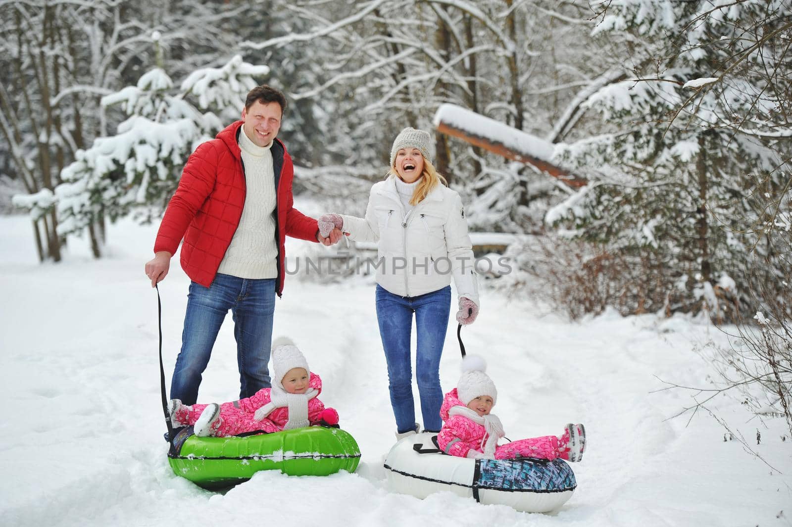 A large family with children on a walk in winter.
