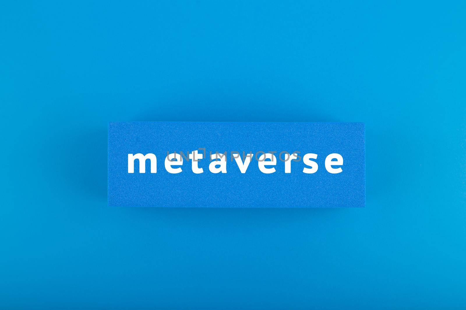 Metaverse modern minimal concept in blue colors. Written metaverse single word on blue rectangle against blue background. Future technologies. 
