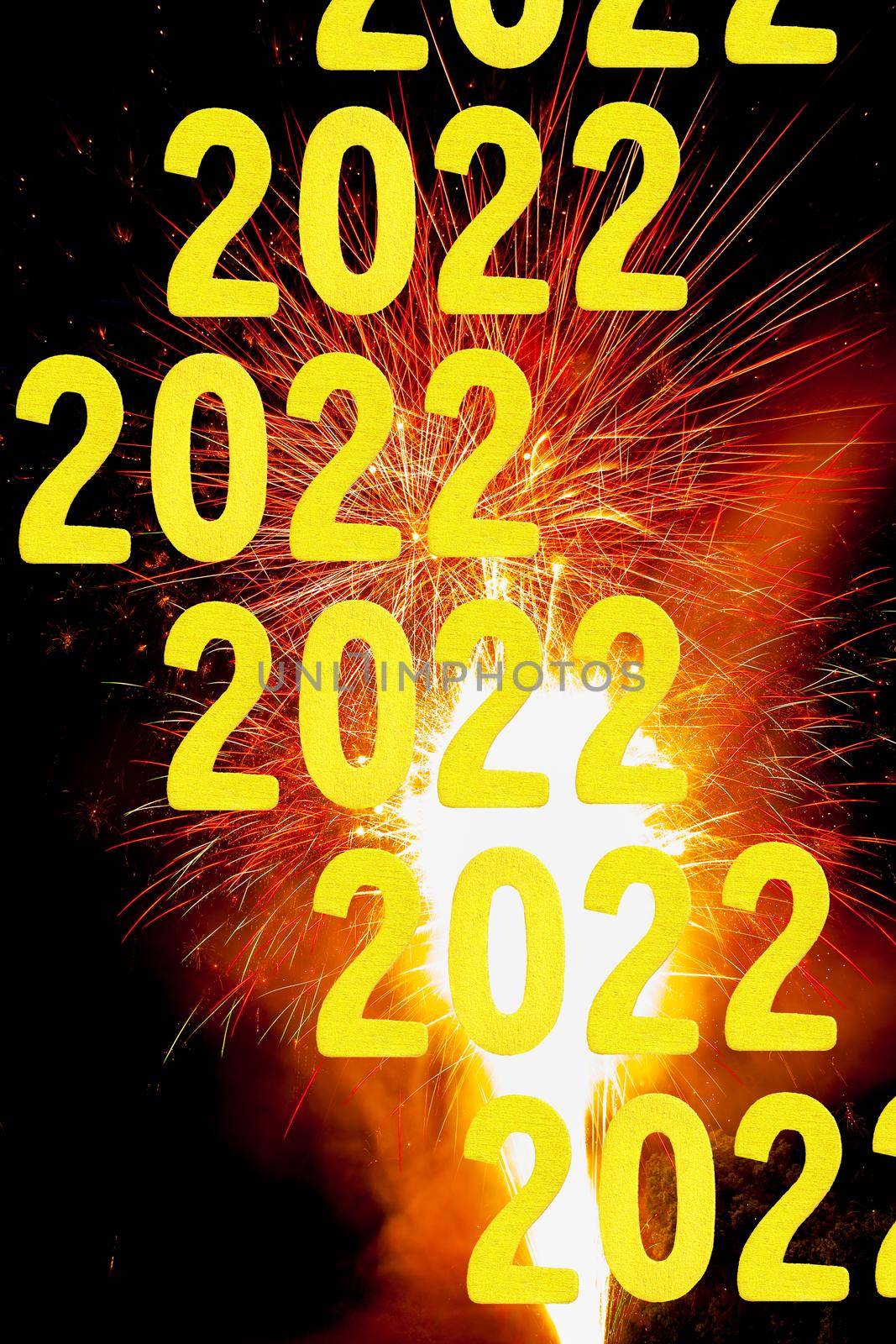 New Years card for 2022 with gold digits on a firework background.