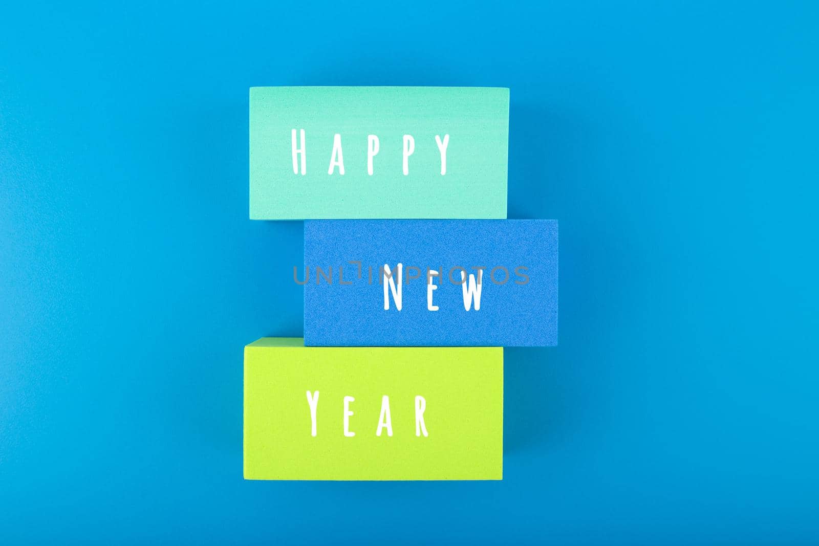Happy New Year minimal creative concept on blue background by Senorina_Irina
