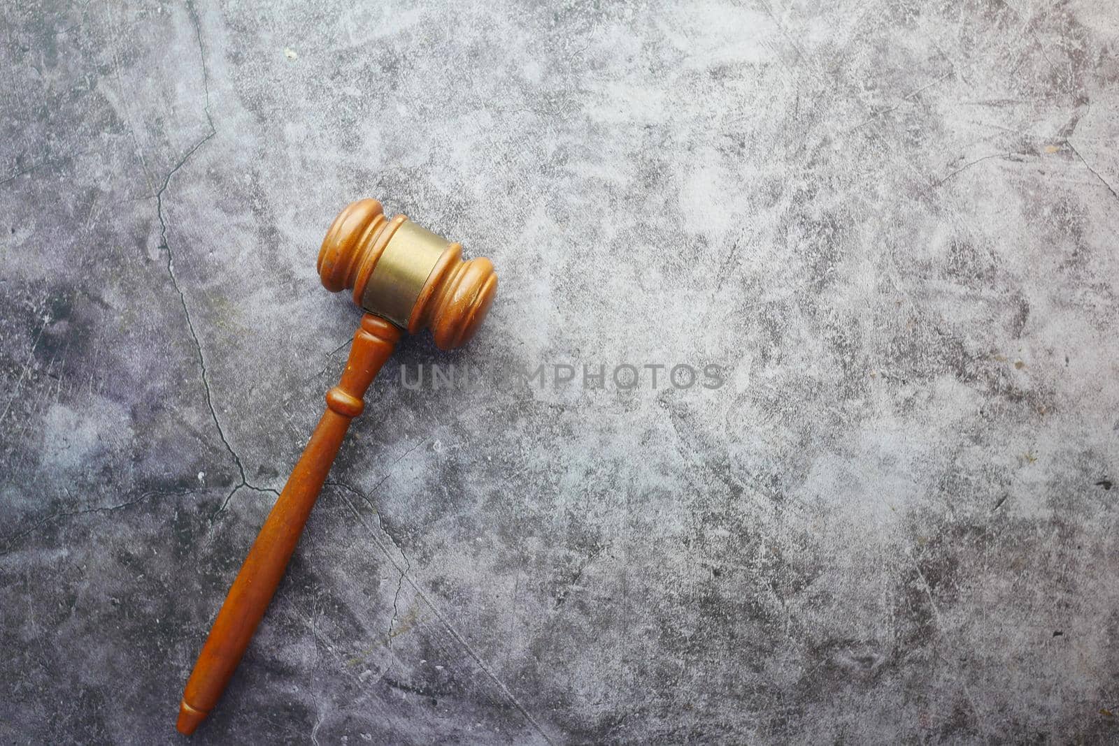 Top view of gavel on black background with copy space .