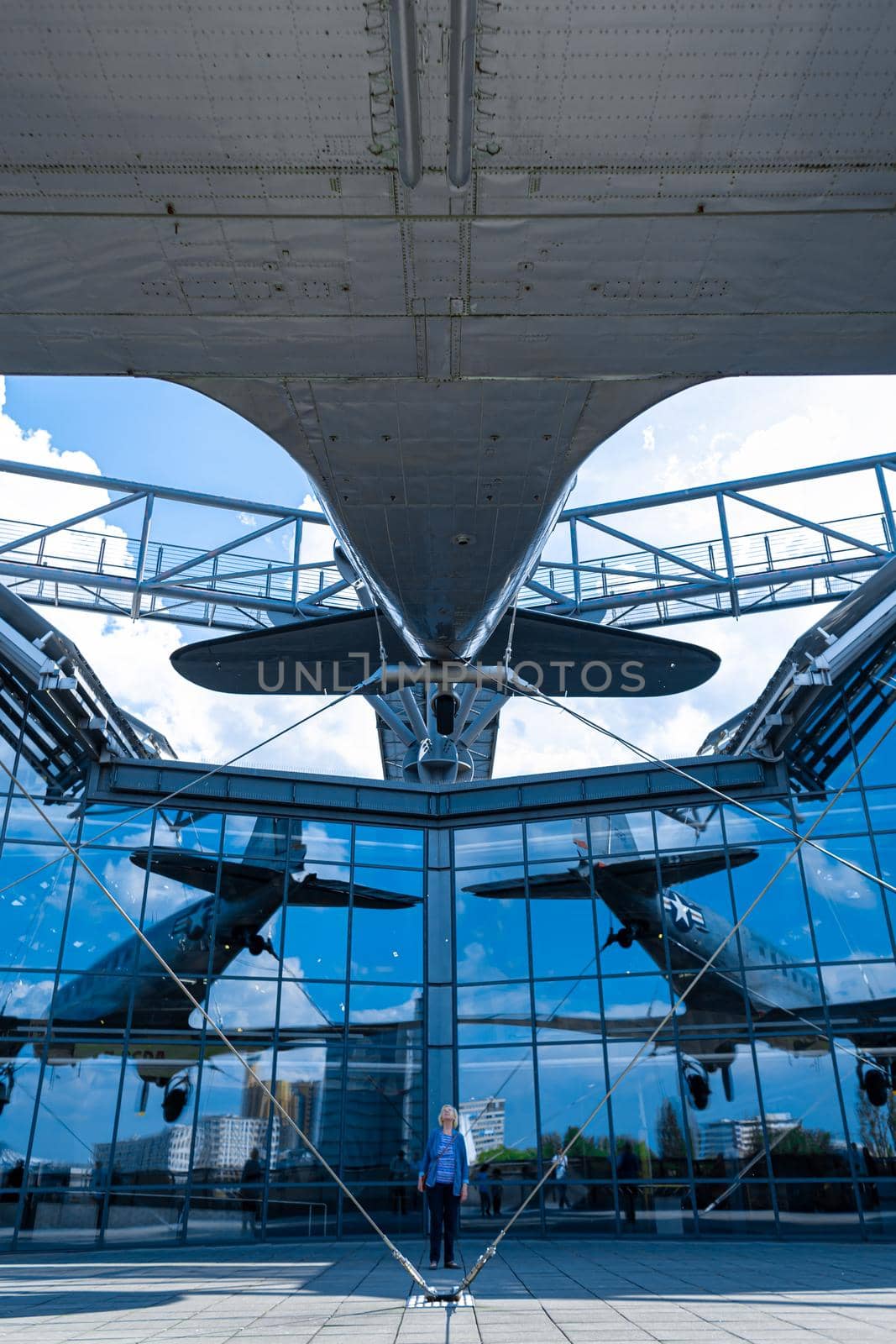 The plane is suspended from the facade of the building of the Aircraft Museum in Berlin. Berlin, Germany - 05.17.2019
