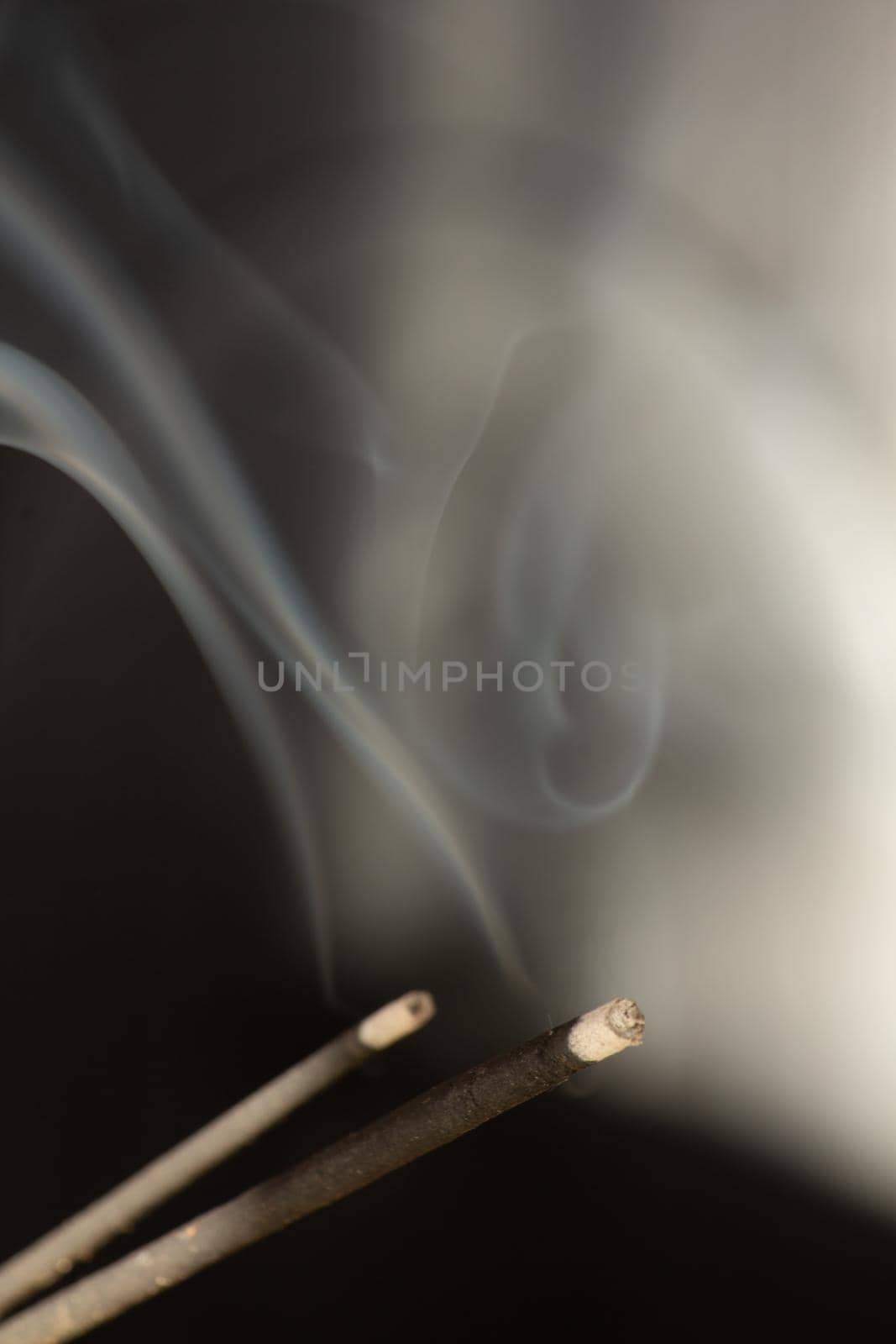 A close up asian aroma smoke stick . High quality photo