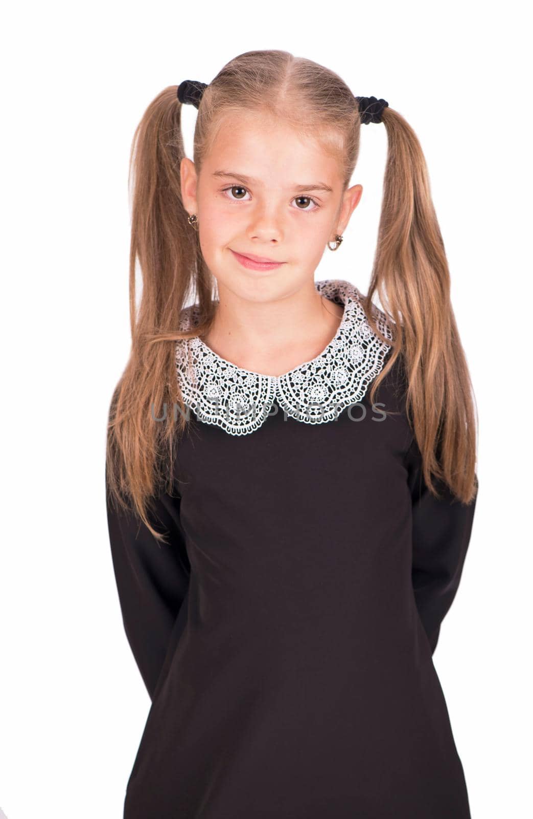 portrait of the youngest schoolgirlisolated on white background.