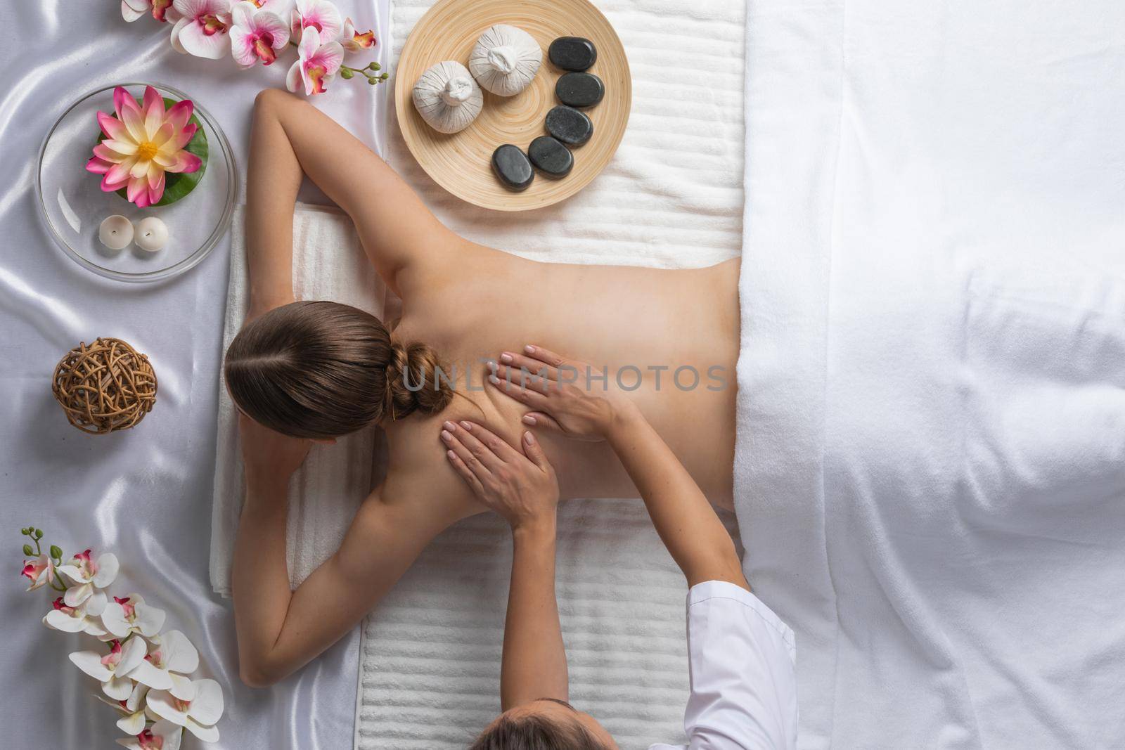 Woman at spa massage by ALotOfPeople