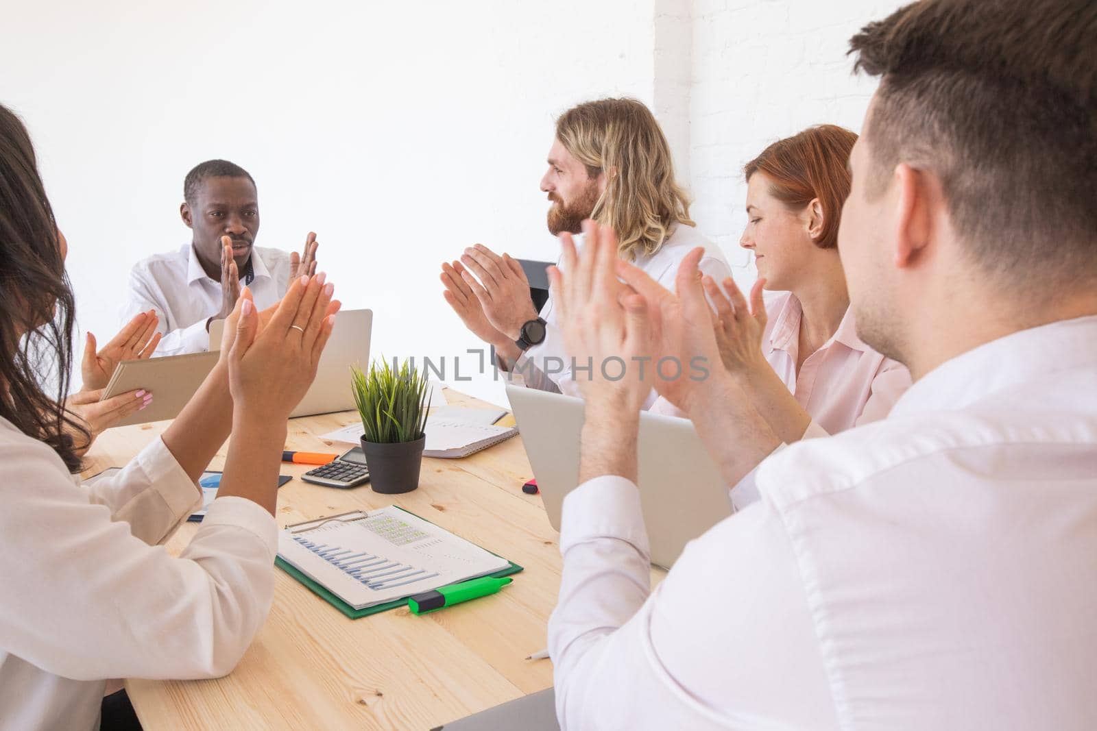 Business people applause at meeting by ALotOfPeople