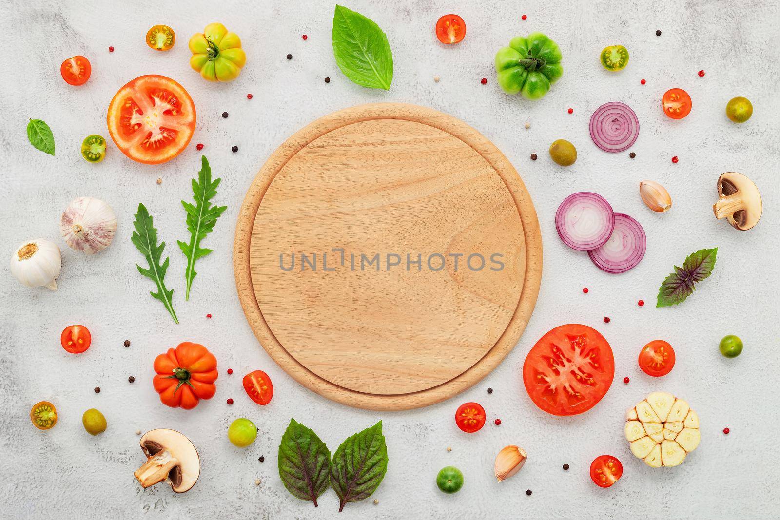The ingredients for homemade pizza set up on white concrete background  flat lay and copy space. by kerdkanno