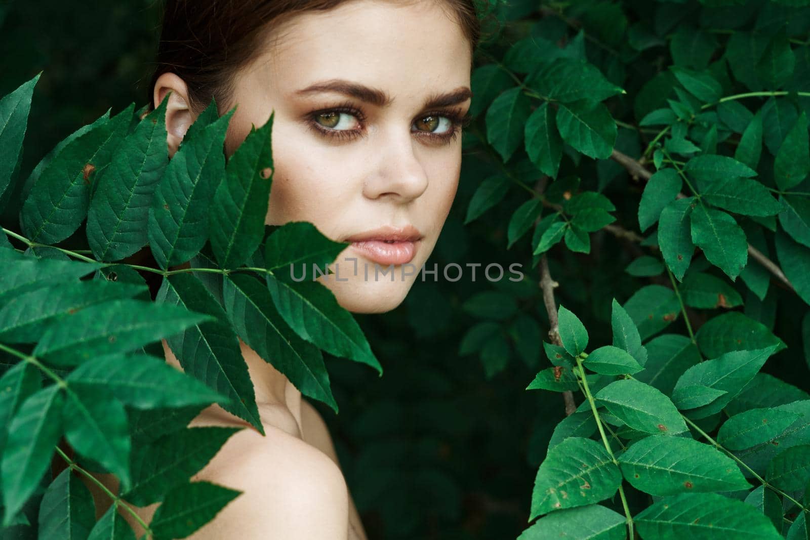 portrait of a woman green leaves clean skin nature summer model by Vichizh