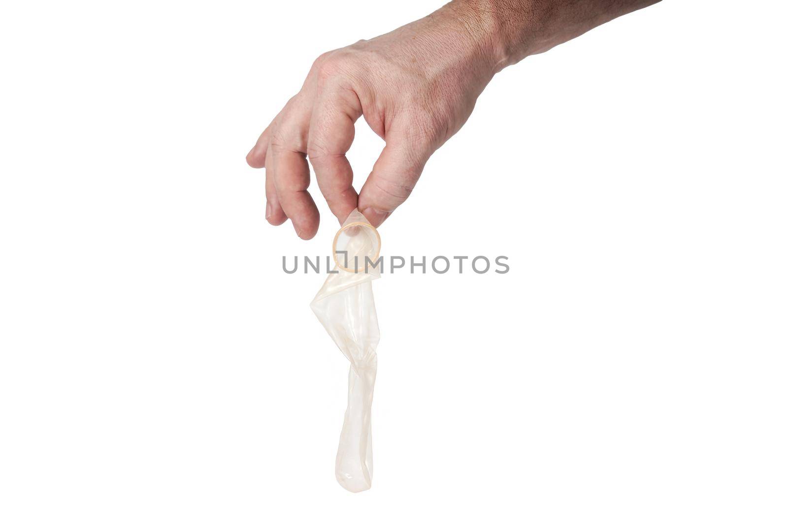 Hand holds a condom on a white background by vizland