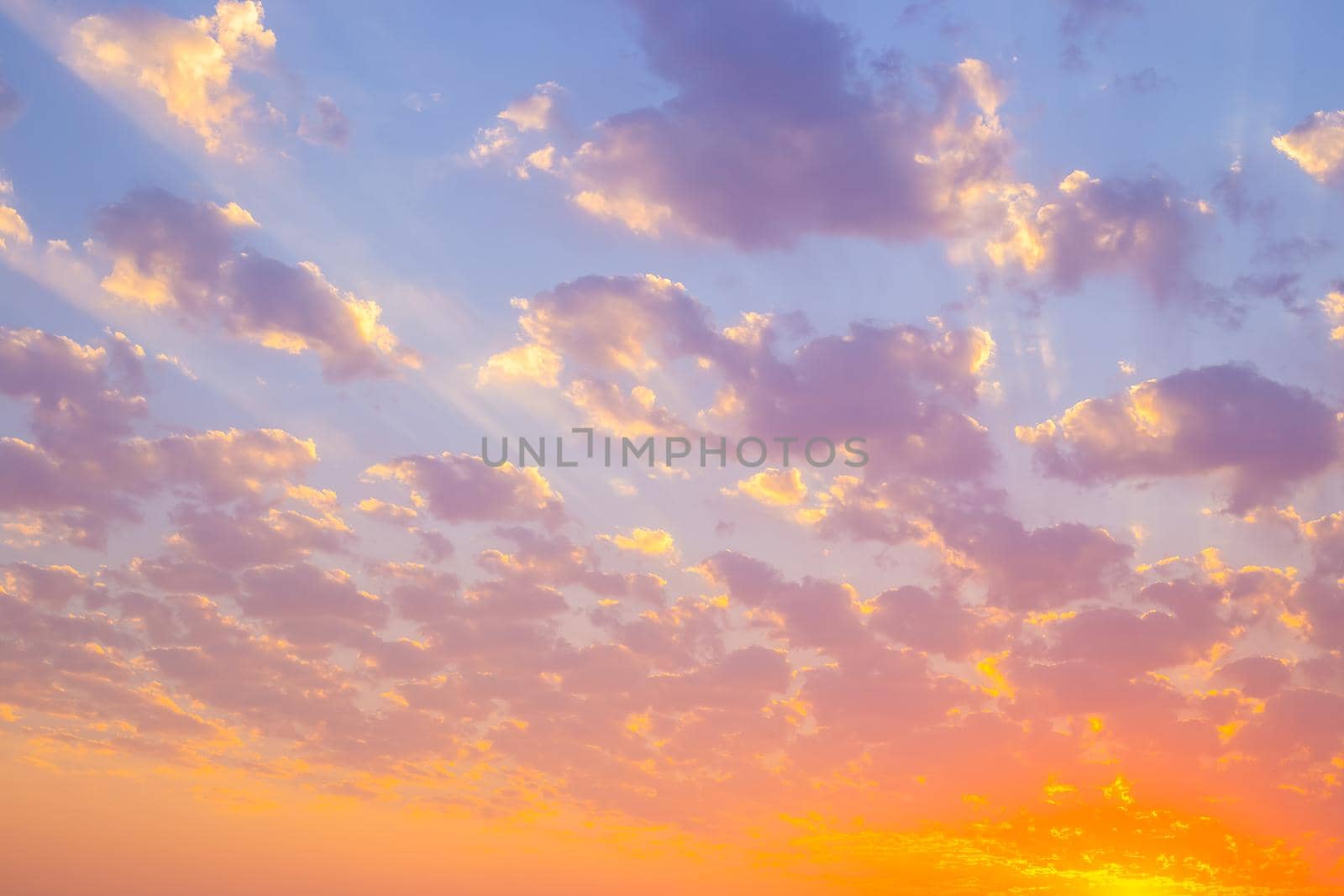 Bright sky with clouds at sunset. Beautiful cloudy landscape.