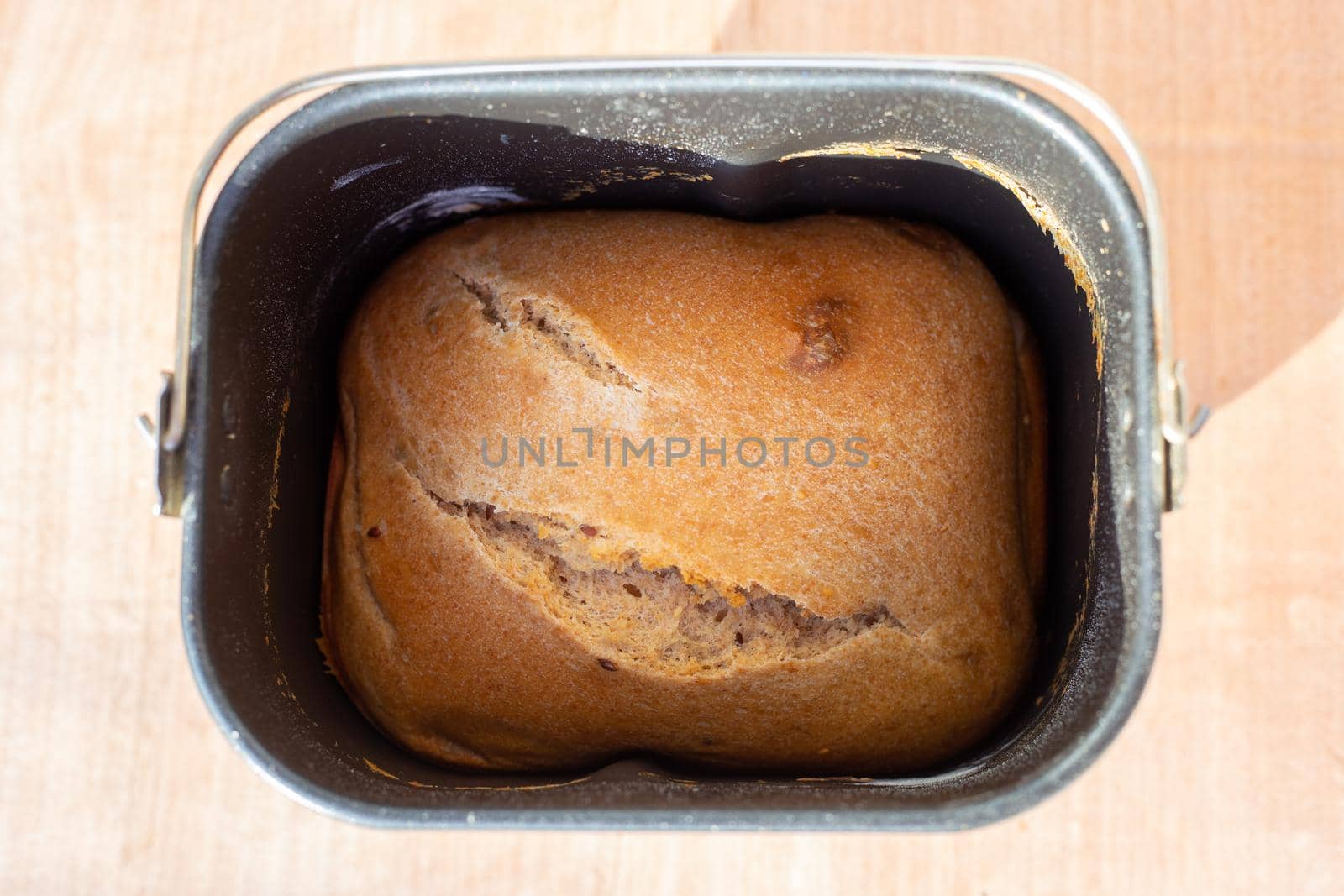 Homemade baked goods. A loaf of fresh bread in an electric bread maker.