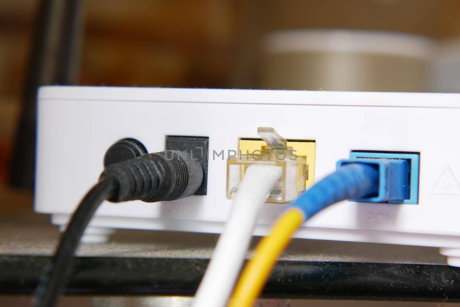 Wi-Fi router with cables on table .