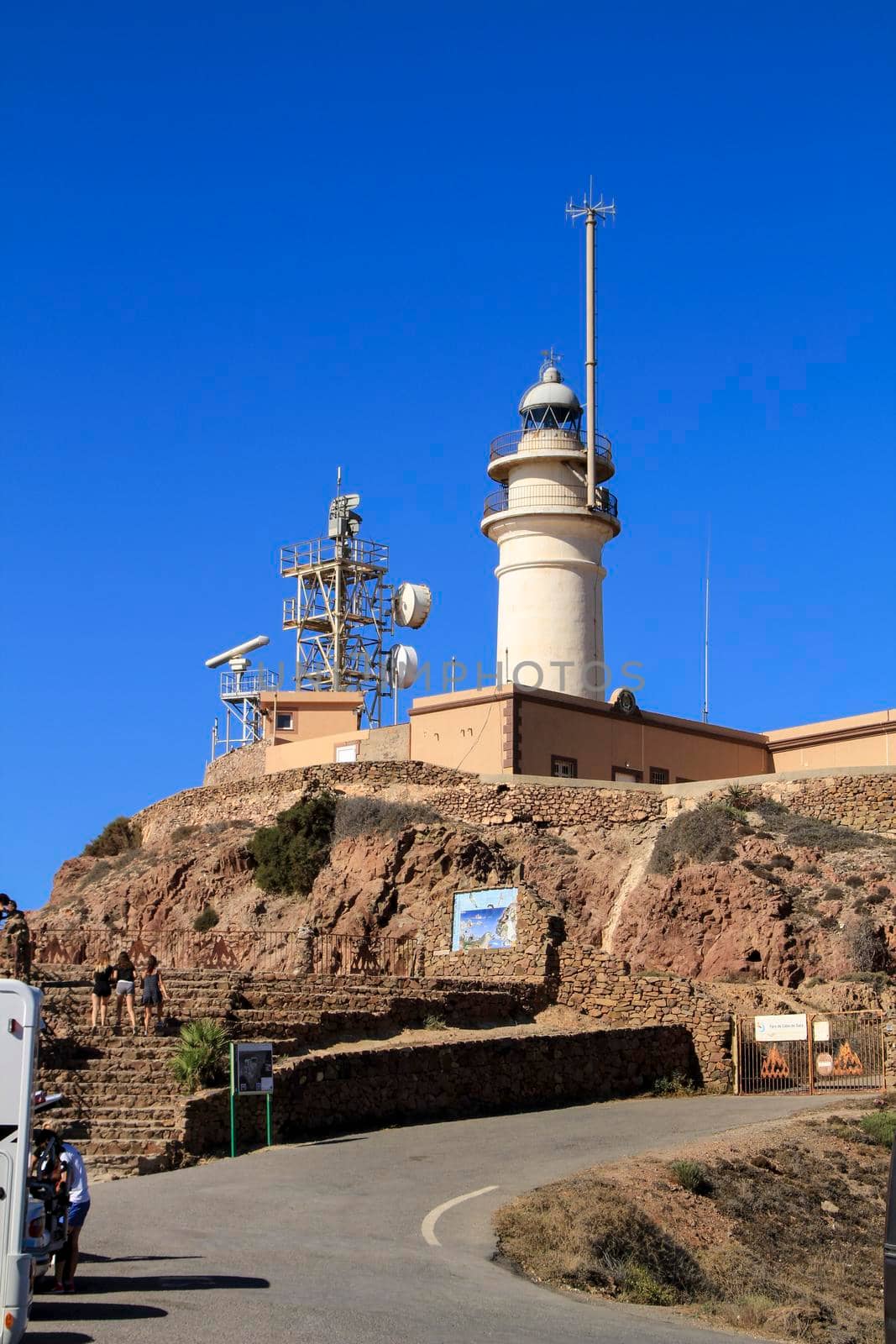 Cabo de Gata, Almeria, Spain- September 3, 2021: Beautiful Cabo de Gata Lighthouse under blue sky in summer
