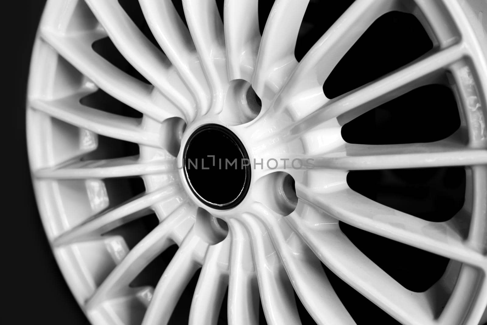 White alloy wheels for premium cars, close-up. Purchase and replacement of autodisks.