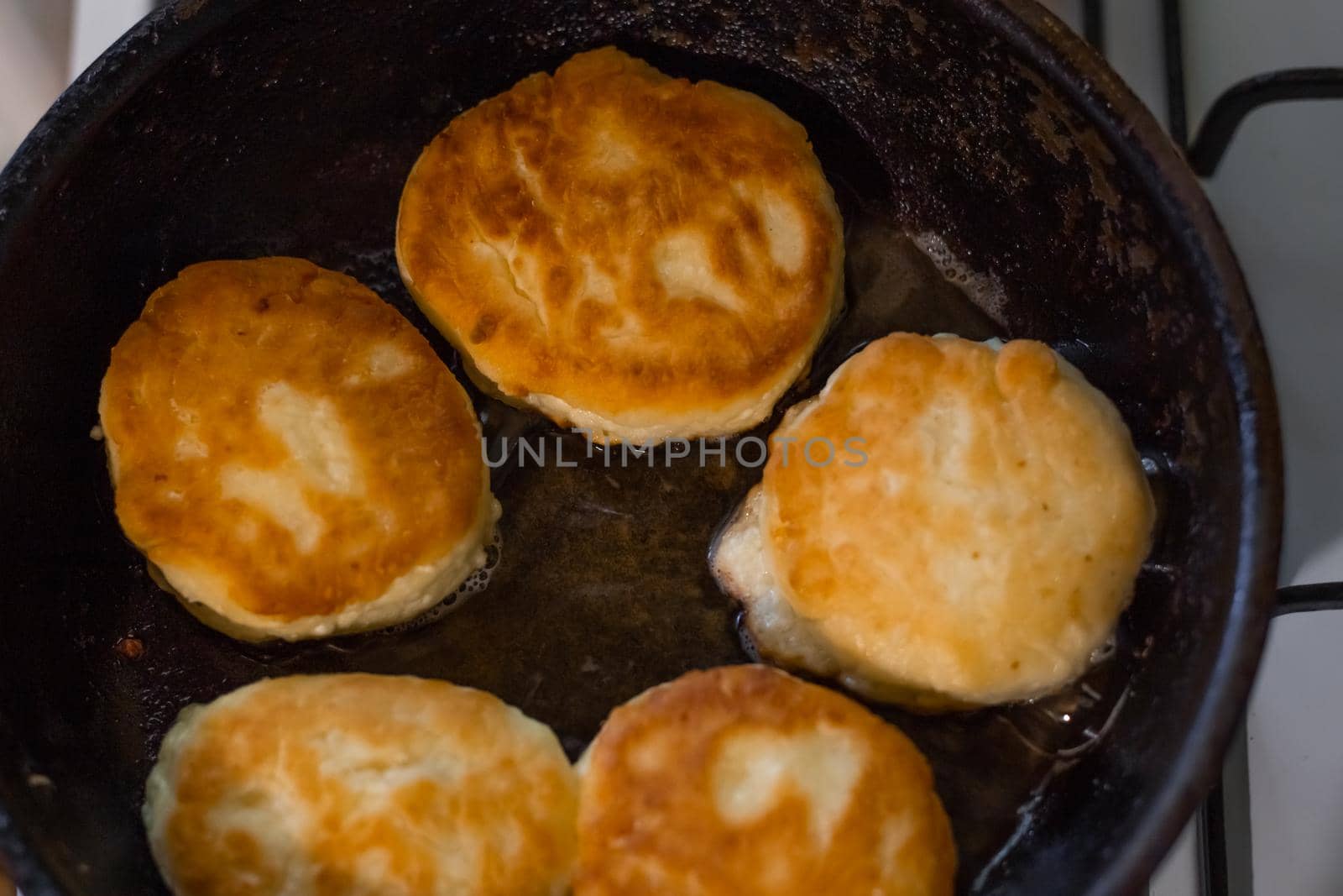 Freshly fried pancakes are prepared for breakfast. Cooking food in the kitchen.