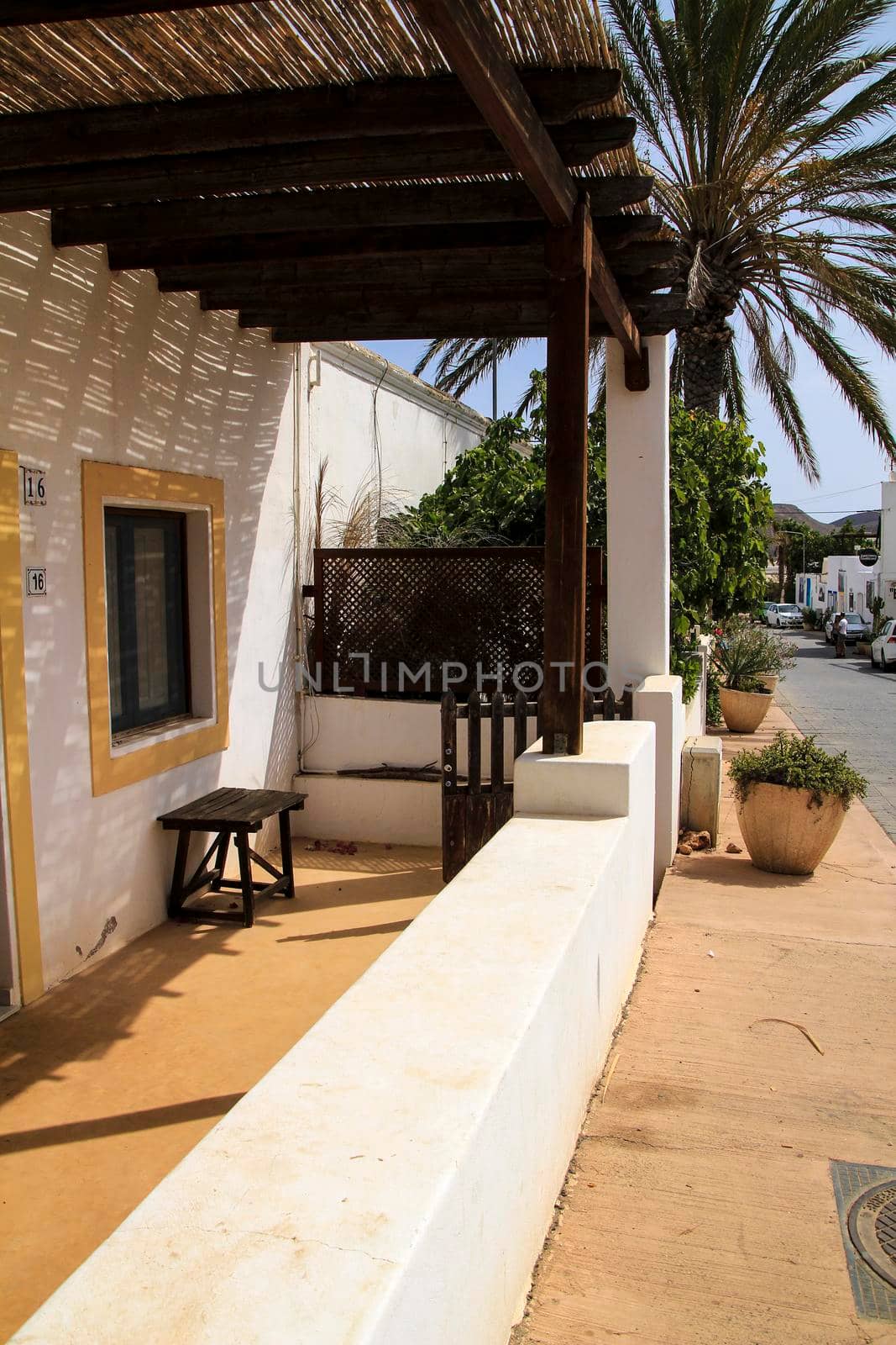 Rodalquilar, Almeria, Spain- September 7, 2021: Whitewashed houses with bougainvillea and cactus in Rodalquilar, Andalusia, Spain