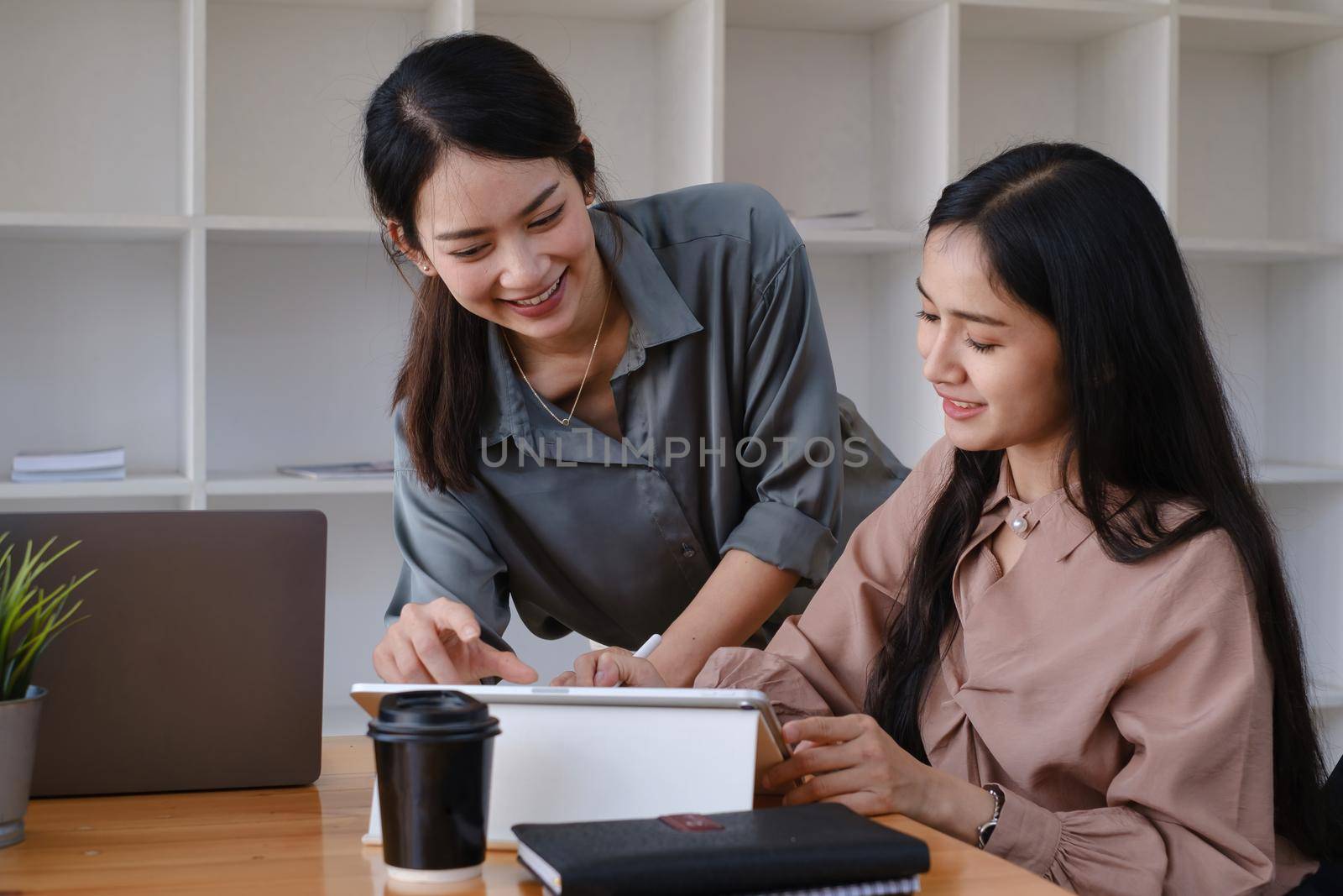 Group of Businesswoman and Accountant checking data document on paperwork for investigation of corruption account. Anti Bribery concept by itchaznong