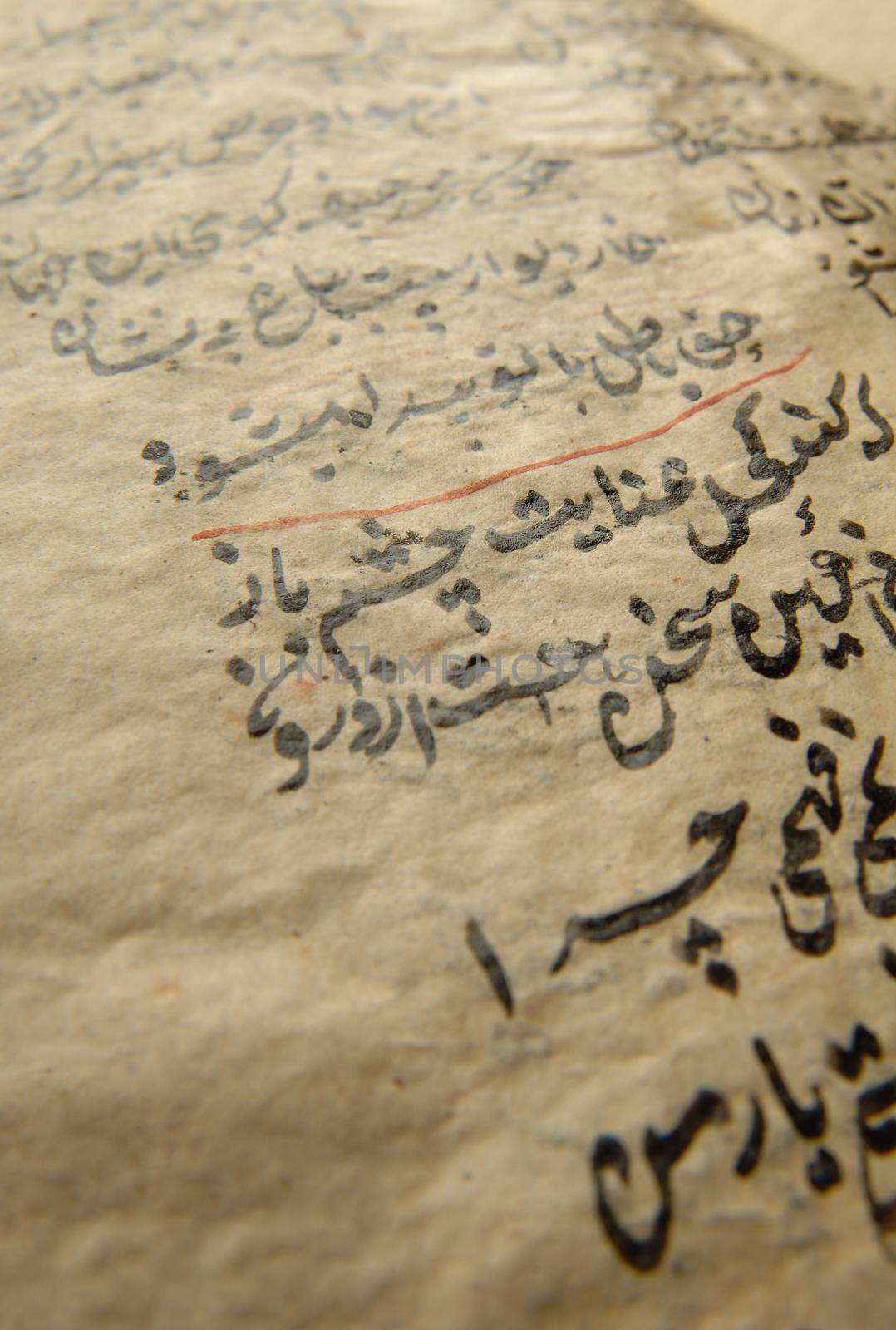 Tashkent, Uzbekistan - August 10, 2009: Ancient open book in arabic. Old arabic manuscripts and texts