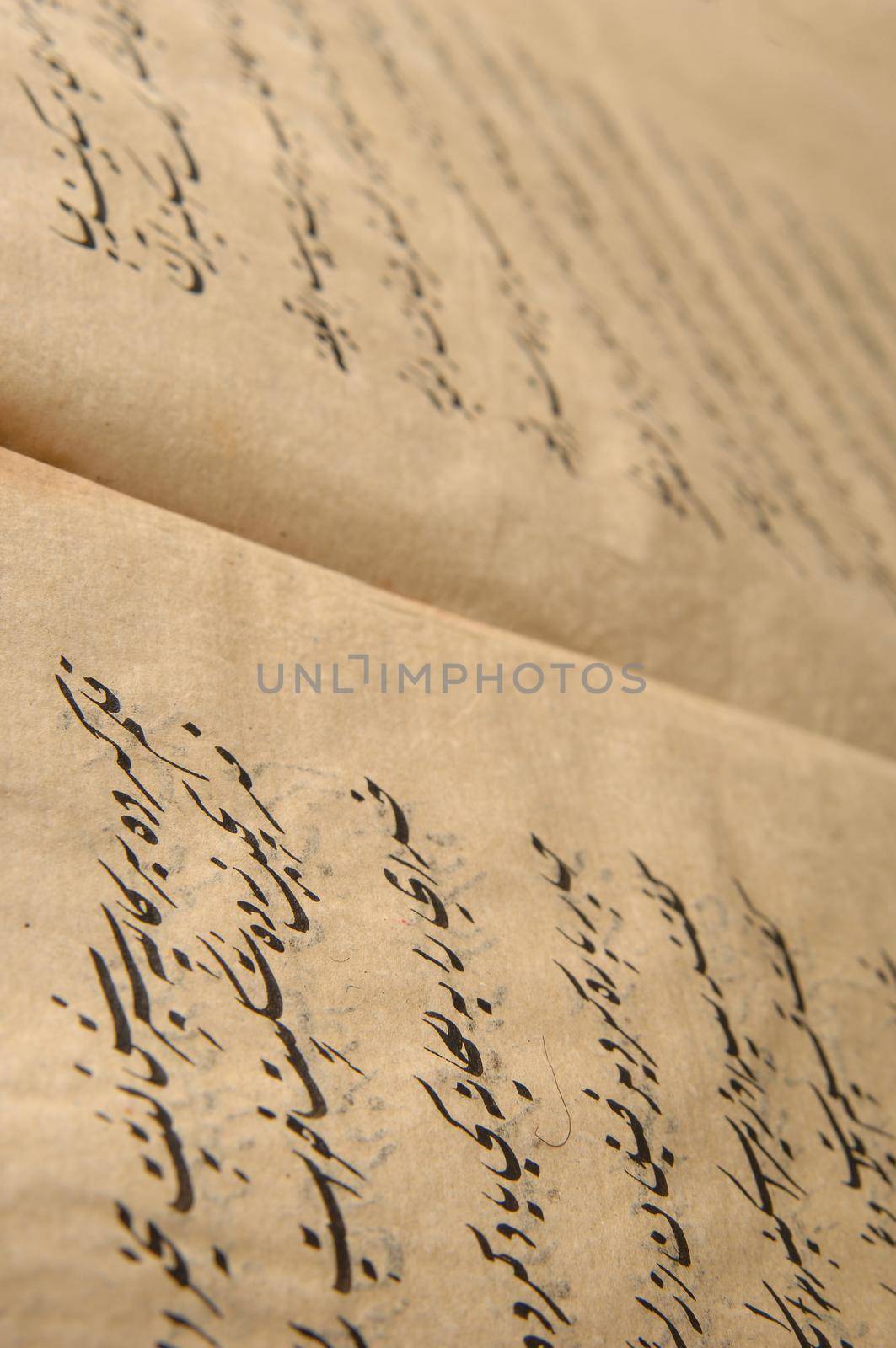 Tashkent, Uzbekistan - August 10, 2009: Ancient open book in arabic. Old arabic manuscripts and texts