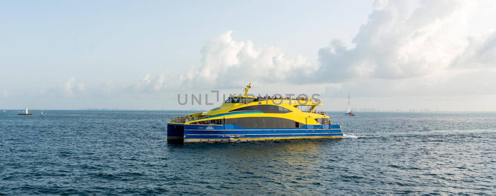 Cancun, Mexico - September 13, 2021: Ultramar ferry traveling with tourists from Cancun to Isla Mujeres by Mariakray