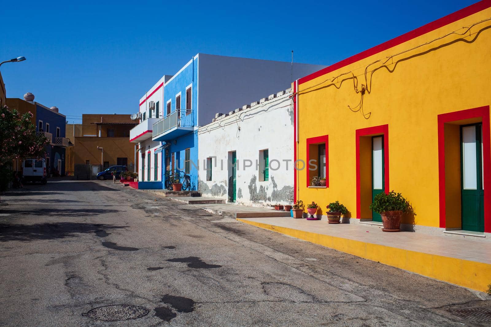 View of a typical street of Linosa with colorful house, Sicily. Italy