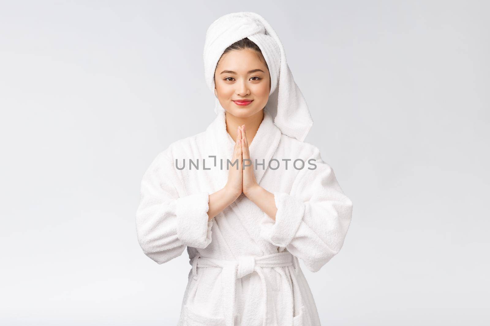 Beautiful women take care of skin health holding hand praying. Beautiful girl on white background. by Benzoix