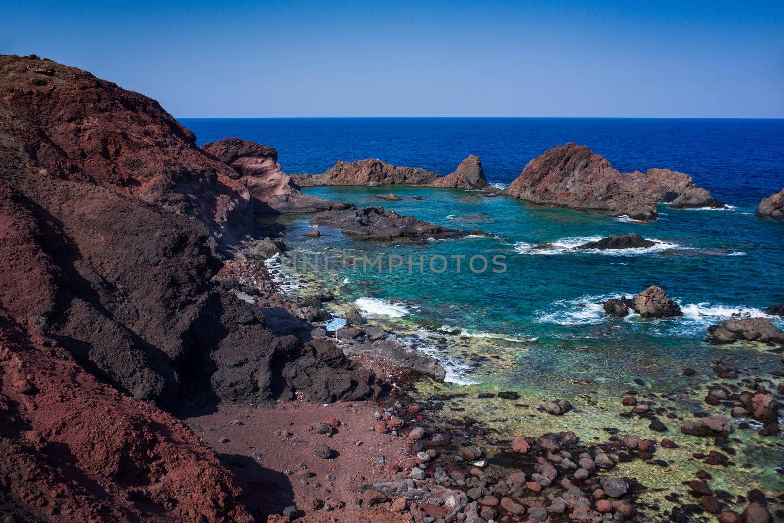 View of the lava beach of Linosa Called Faraglioni, Sicily. Italy