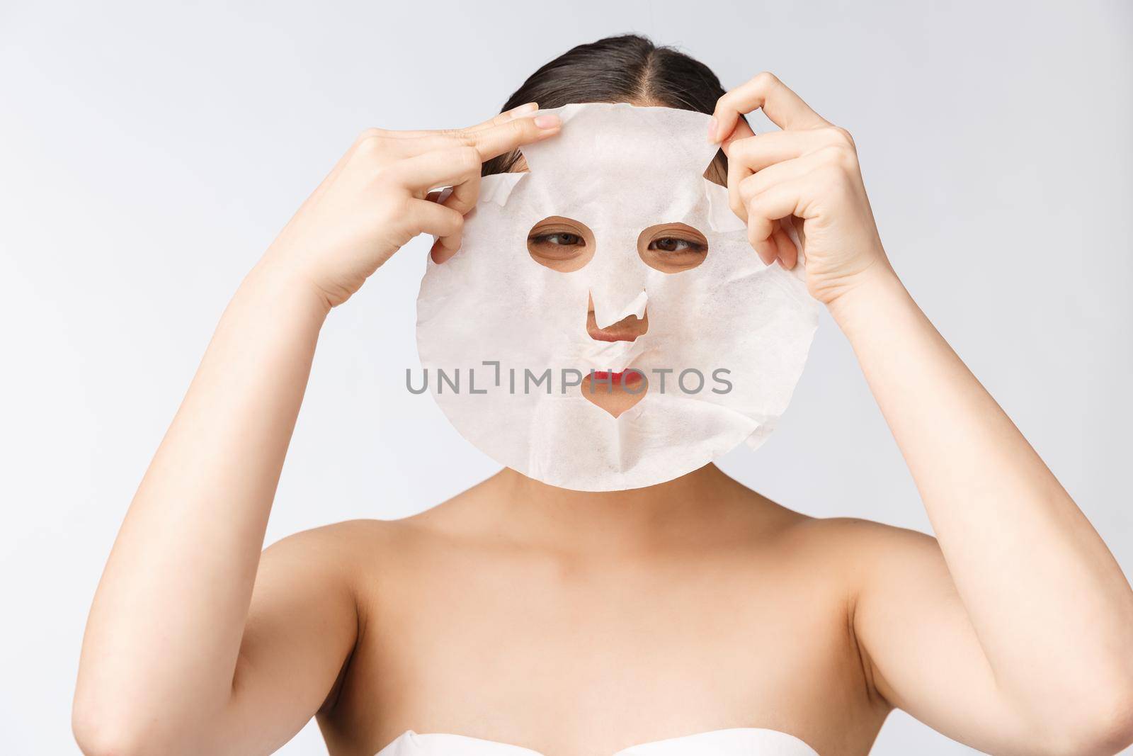 Spa, healthcare. Woman with purifying mask on her face isolated on white background