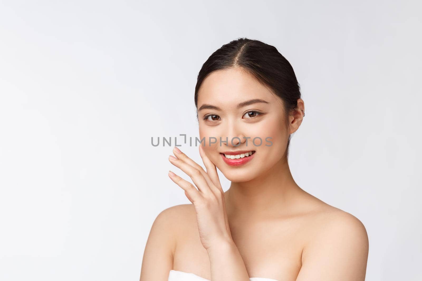 Beautiful asian woman makeup of cosmetic, girl hand touch cheek and smile, face of beauty perfect with wellness isolated on white background. by Benzoix