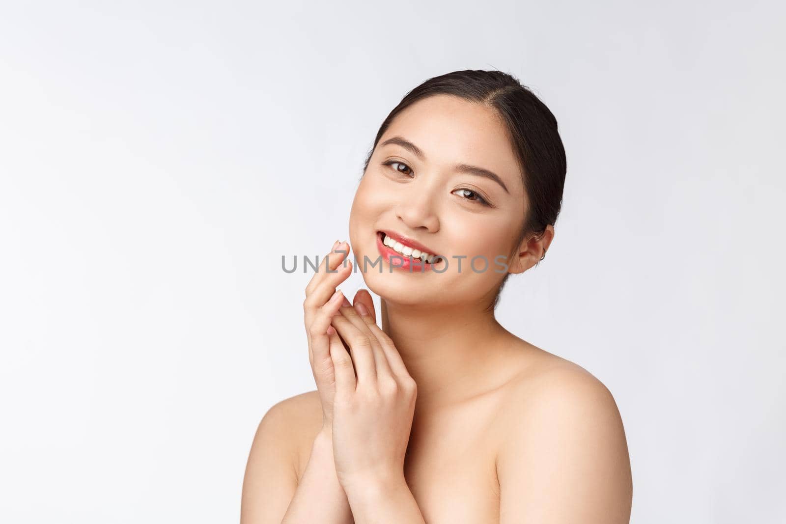 Beautiful asian woman makeup of cosmetic, girl hand touch cheek and smile, face of beauty perfect with wellness isolated on white background. by Benzoix