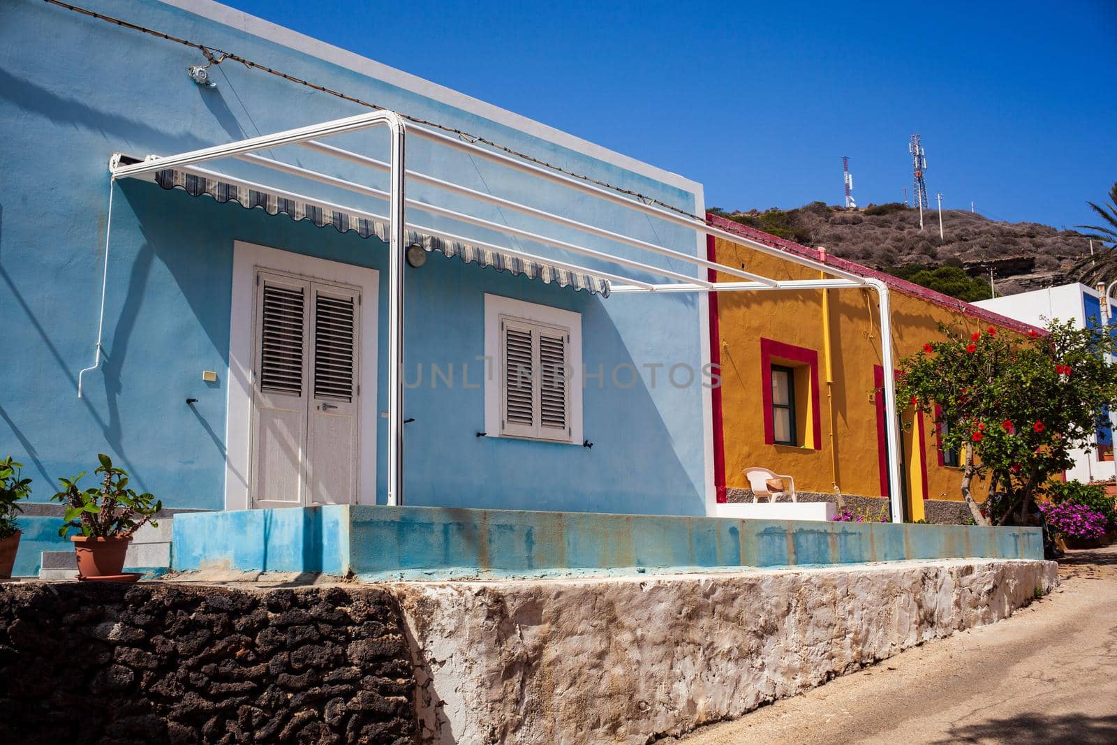 View of a typical colorful houses in the street of Linosa, Sicily. Italy