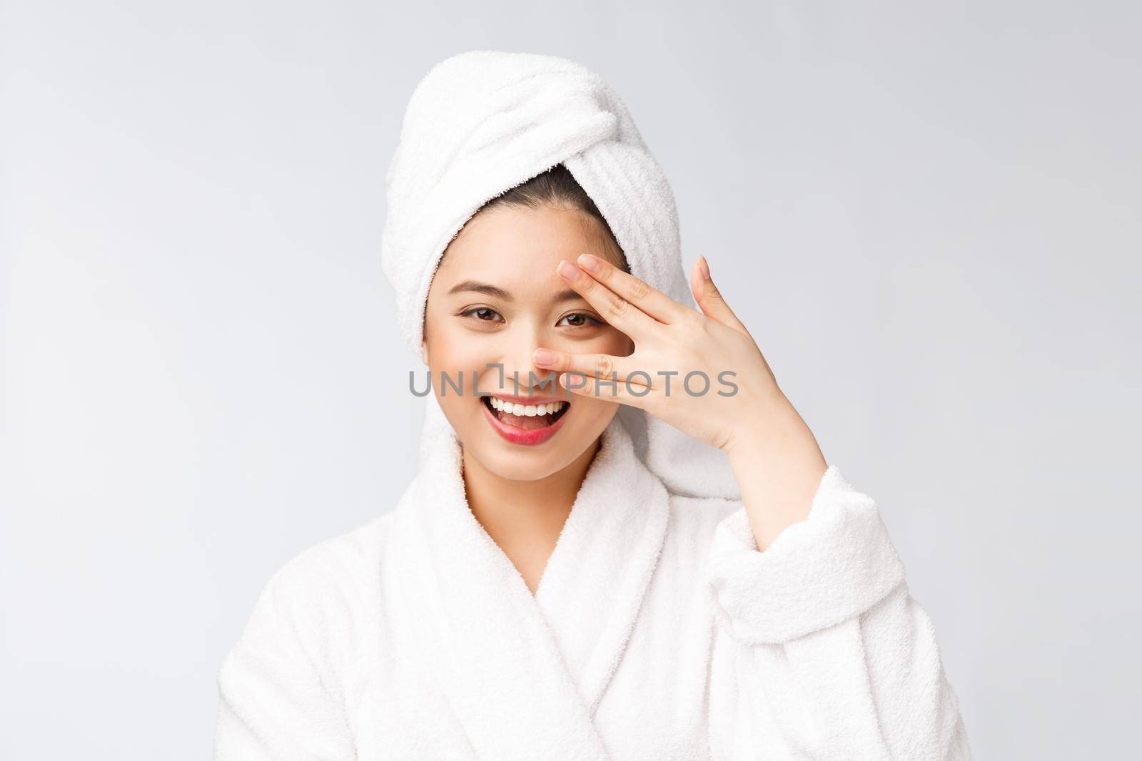 Spa skincare beauty Asian woman drying hair with towel on head after shower treatment. Beautiful multiracial young girl touching soft skin by Benzoix
