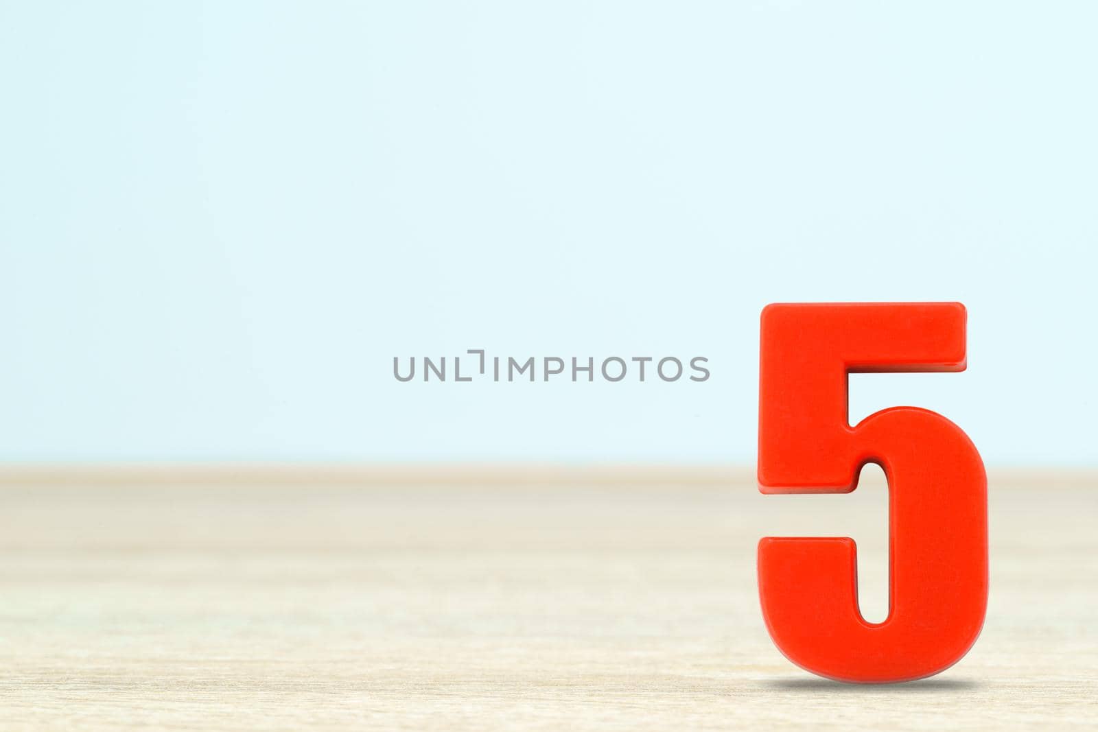 Shot of a number five made of red plastic  by stoonn
