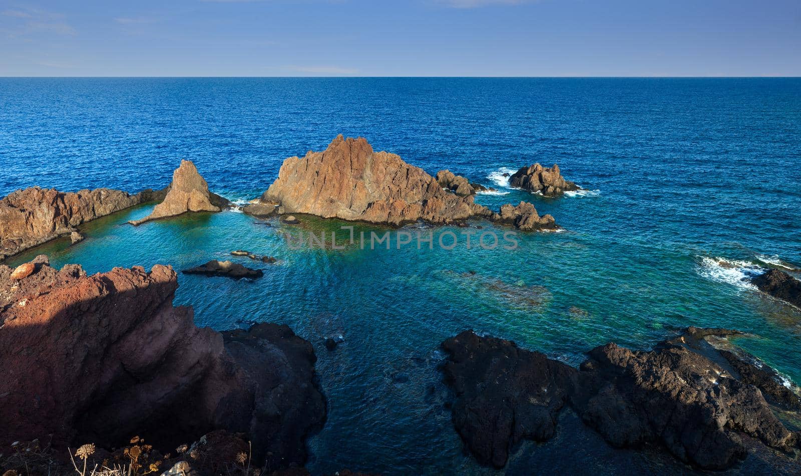 View of the lava beach of Linosa Called Faraglioni, Sicily. Italy