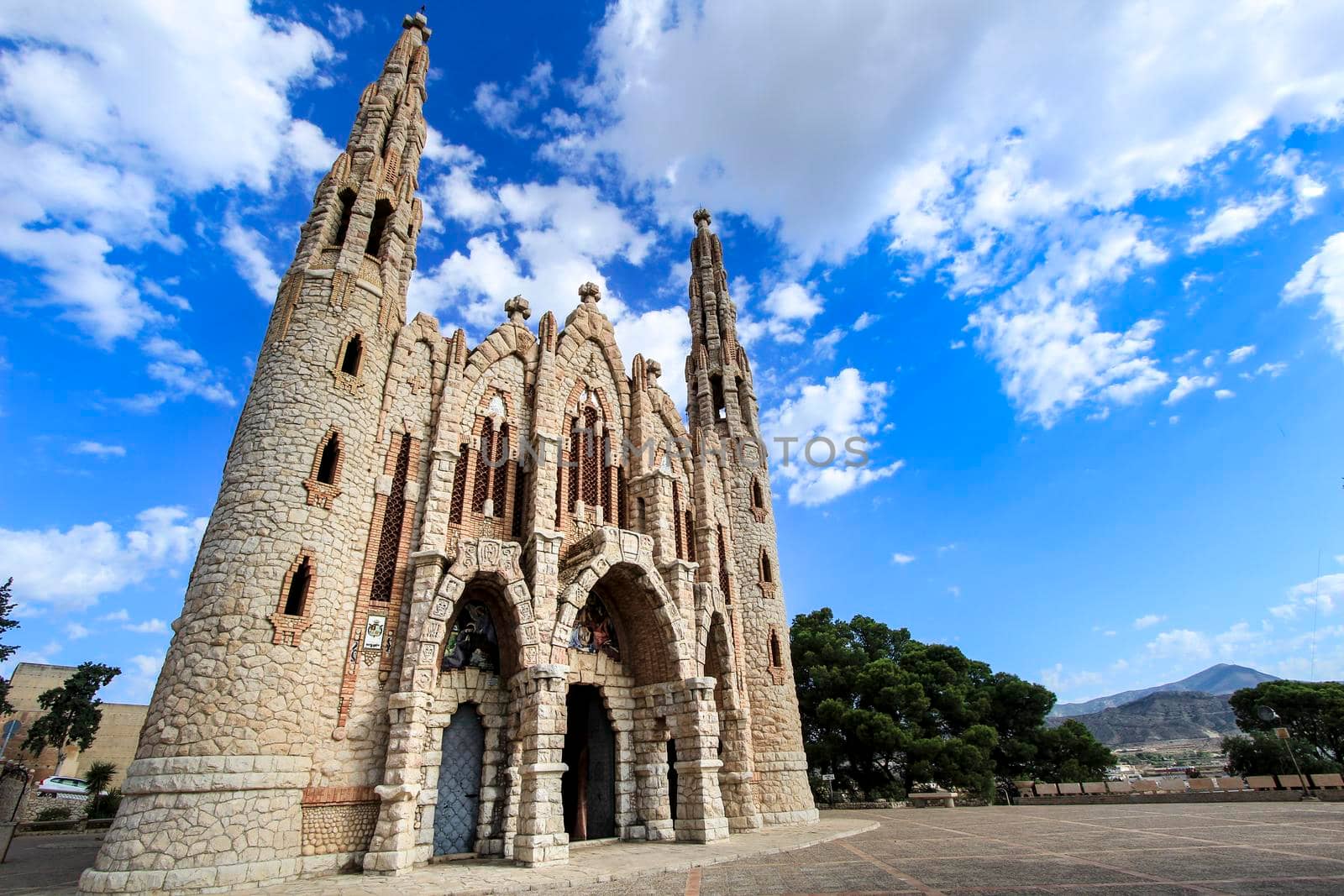 Novelda, Alicante, Spain- September 24, 2021: Details, archs, tower and pictures of Sanctuary of Santa Maria Magdalena on the top of the mountain in Novelda, Alicante, Spain.